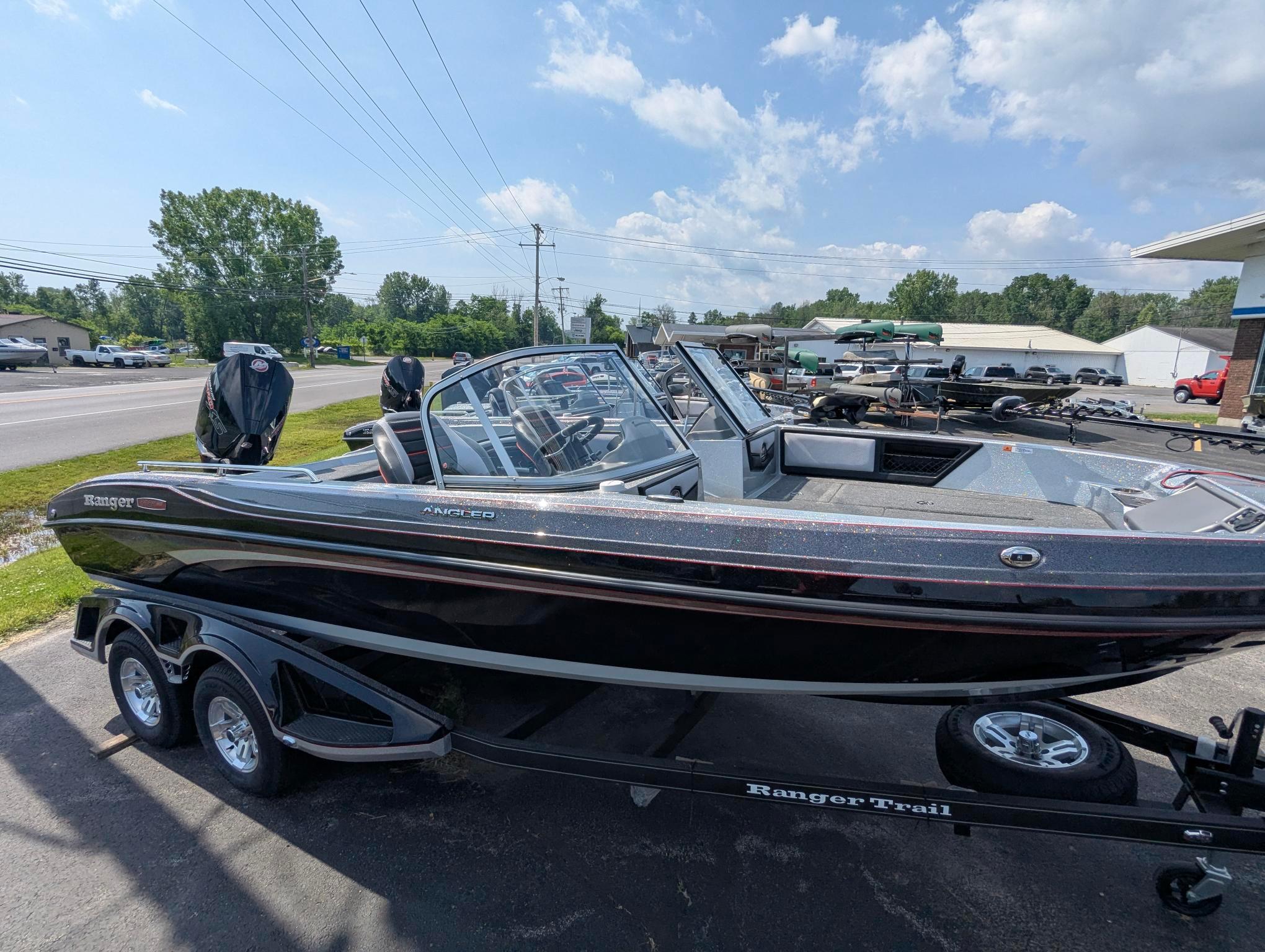 2025 Ranger 2080MS boat on trailer, parked outdoors under a clear sky.