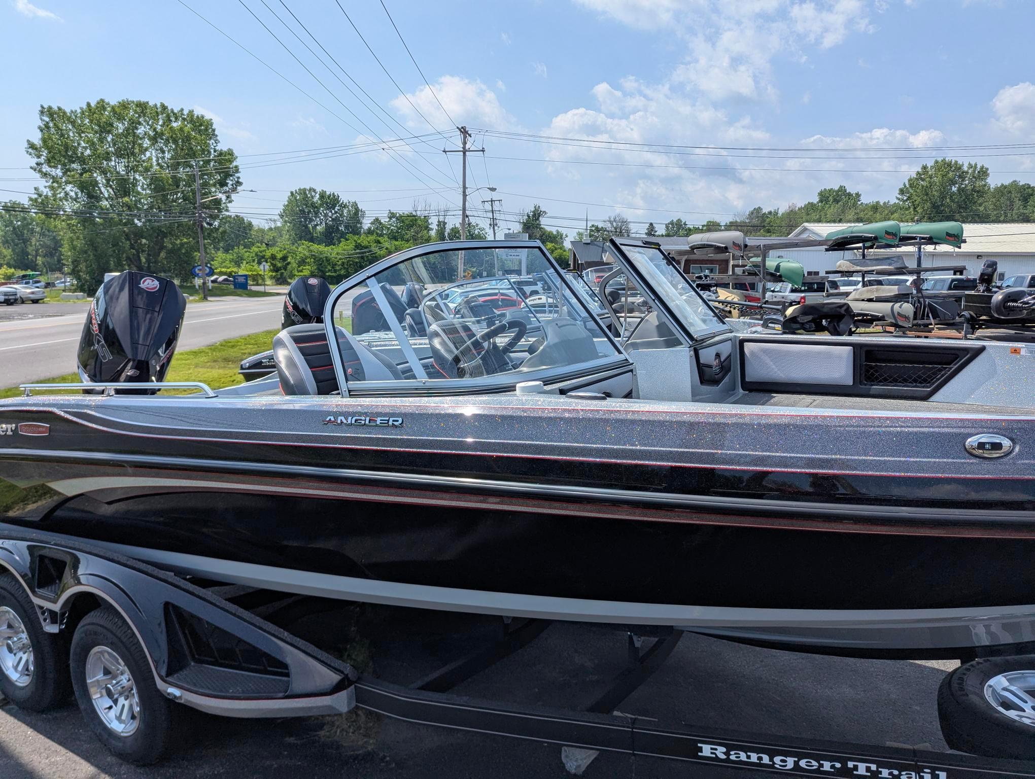 2025 Ranger 2080MS boat on trailer, parked outdoors under a clear sky.
