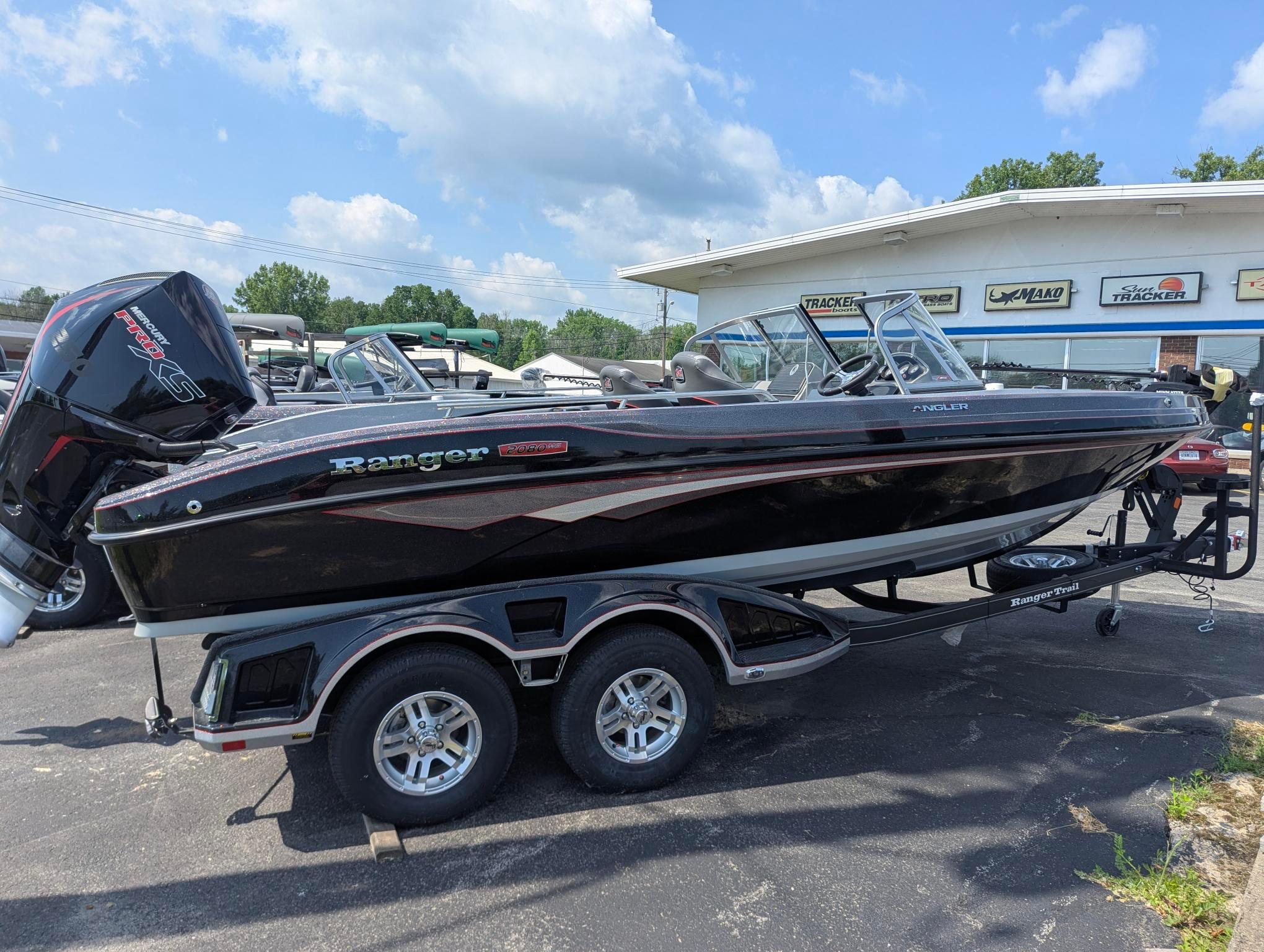 2025 Ranger 2080MS boat on trailer, parked outdoors under a partly cloudy sky.
