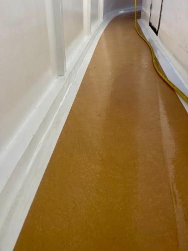 Wet deck of 1977 Grand Alaskan Raised Pilothouse with yellow hose.