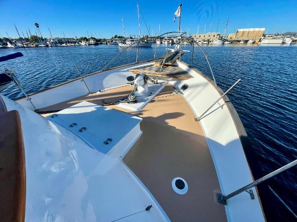 1977 Grand Alaskan Raised Pilothouse yacht deck in a marina setting.