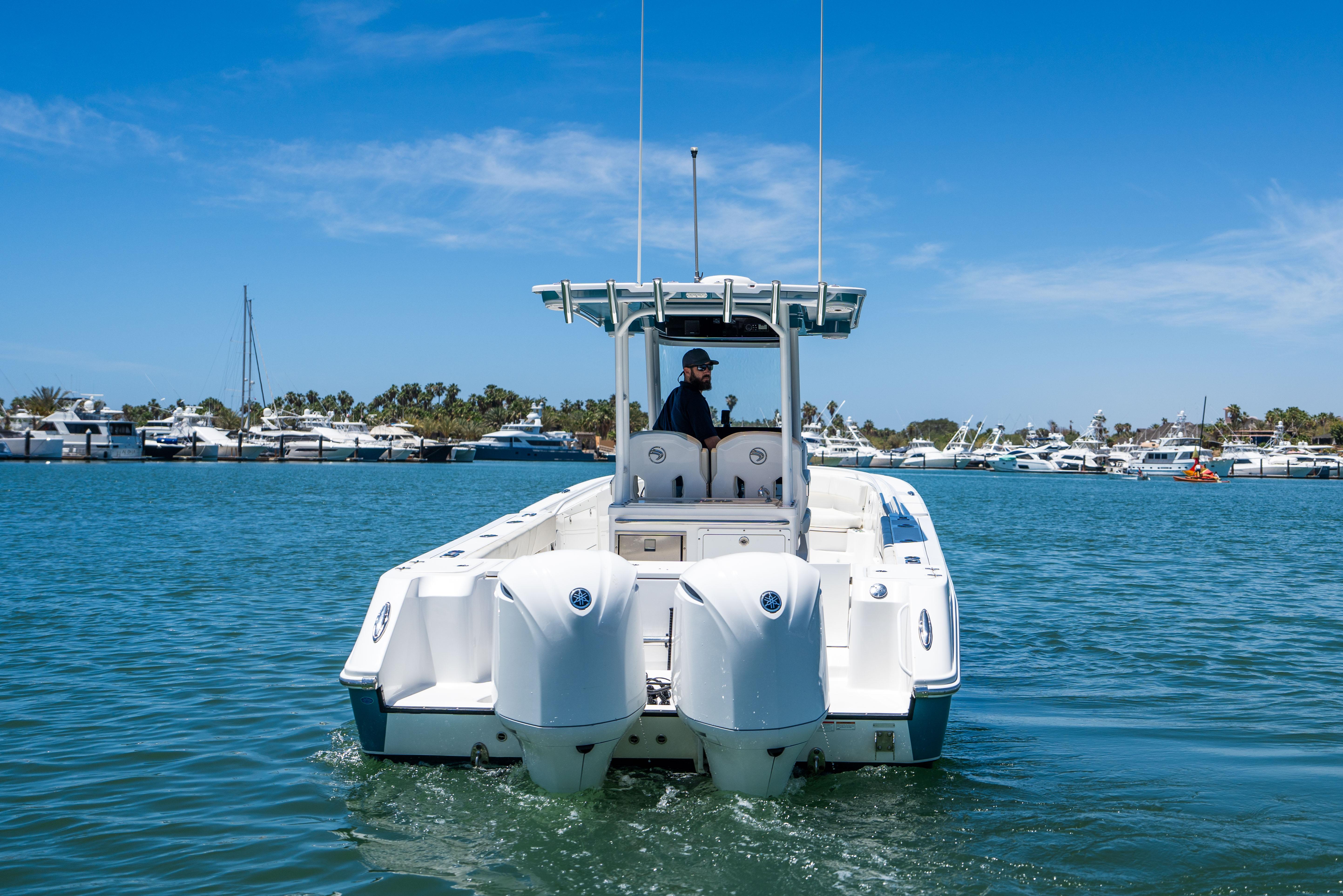 Edgewater-320CC 2020-Carnal CA-US-2020 Edgewater 320CC boat cruising on a sunny day in a marina.-9821525 | Thumbnail