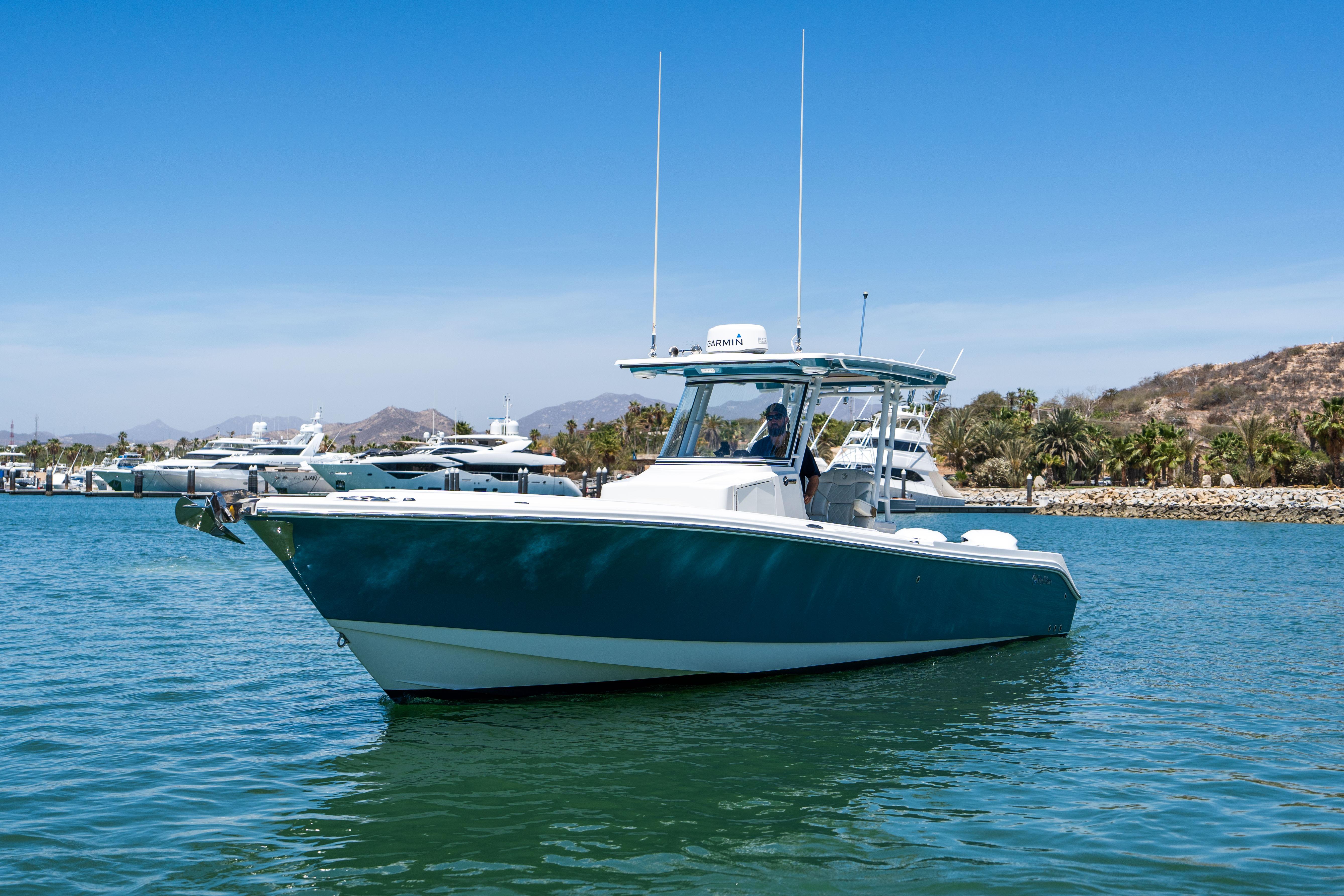 Edgewater-320CC 2020-Carnal CA-US-2020 Edgewater 320CC boat on calm water with clear blue sky.-9821525