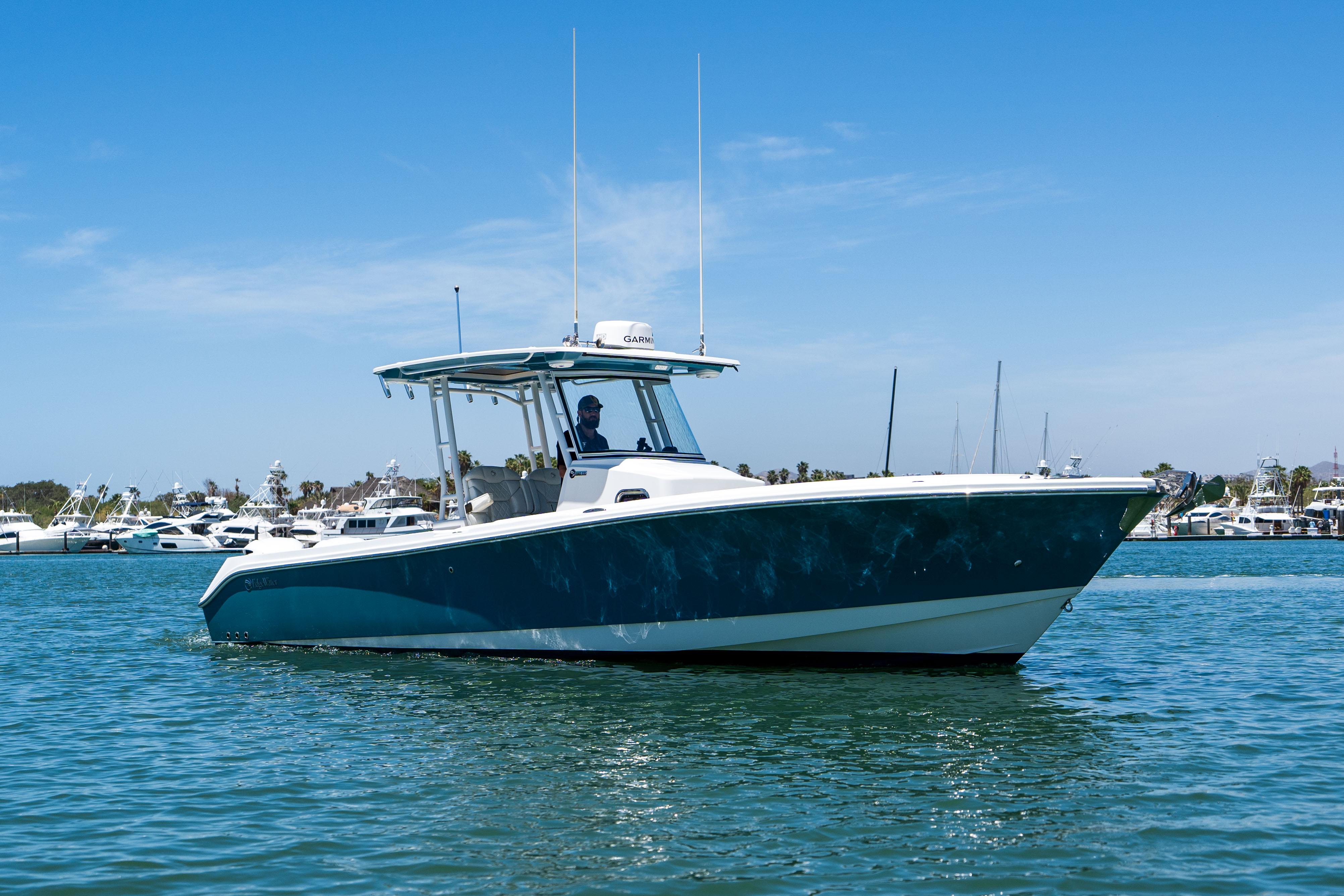 Edgewater-320CC 2020-Carnal CA-US-2020 Edgewater 320CC boat cruising on a sunny day in a marina.-9821525 | Thumbnail
