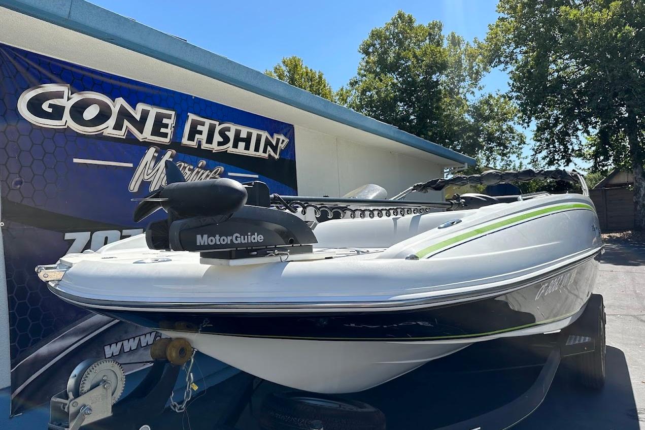 2019 Tahoe 2150 boat with MotorGuide, displayed at Gone Fishin' Marine dealership.