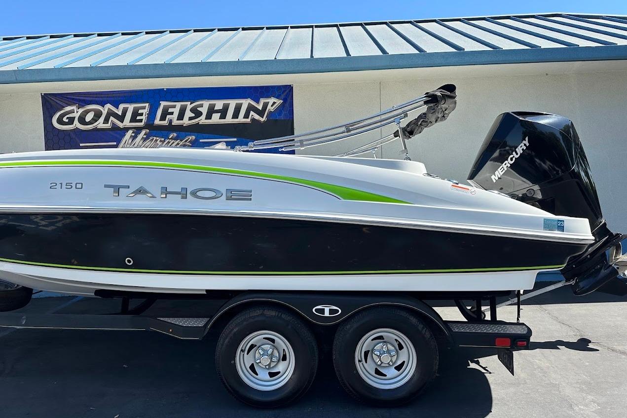 2019 Tahoe 2150 boat with Mercury engine on trailer, parked at Gone Fishin' Marine.