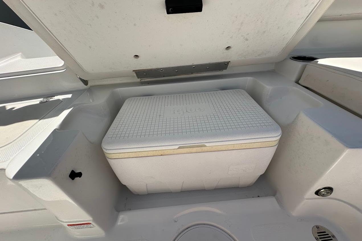 2019 Tahoe 2150 boat storage compartment with cooler inside.