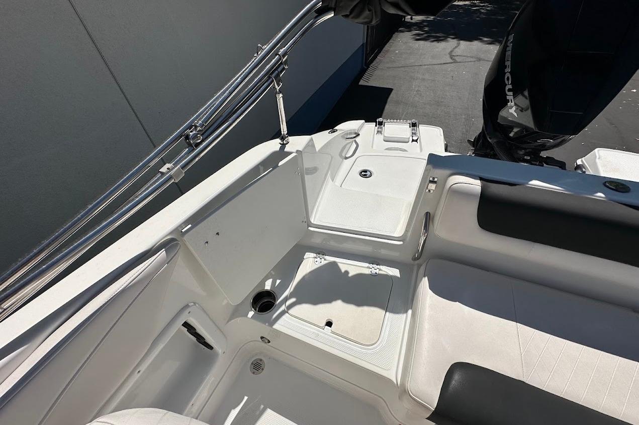2019 Tahoe 2150 boat interior with seating and Mercury outboard motor.