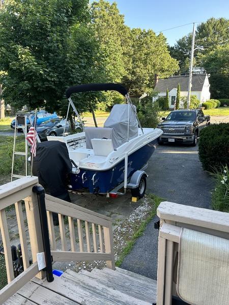 2017 Bayliner Element F18 CC boat on trailer in residential driveway.