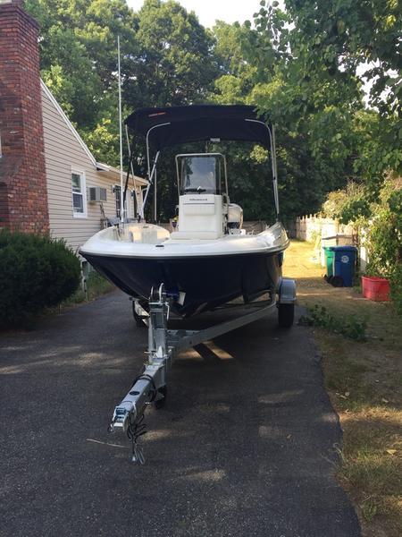 2017 Bayliner Element F18 CC boat on trailer, parked in driveway.