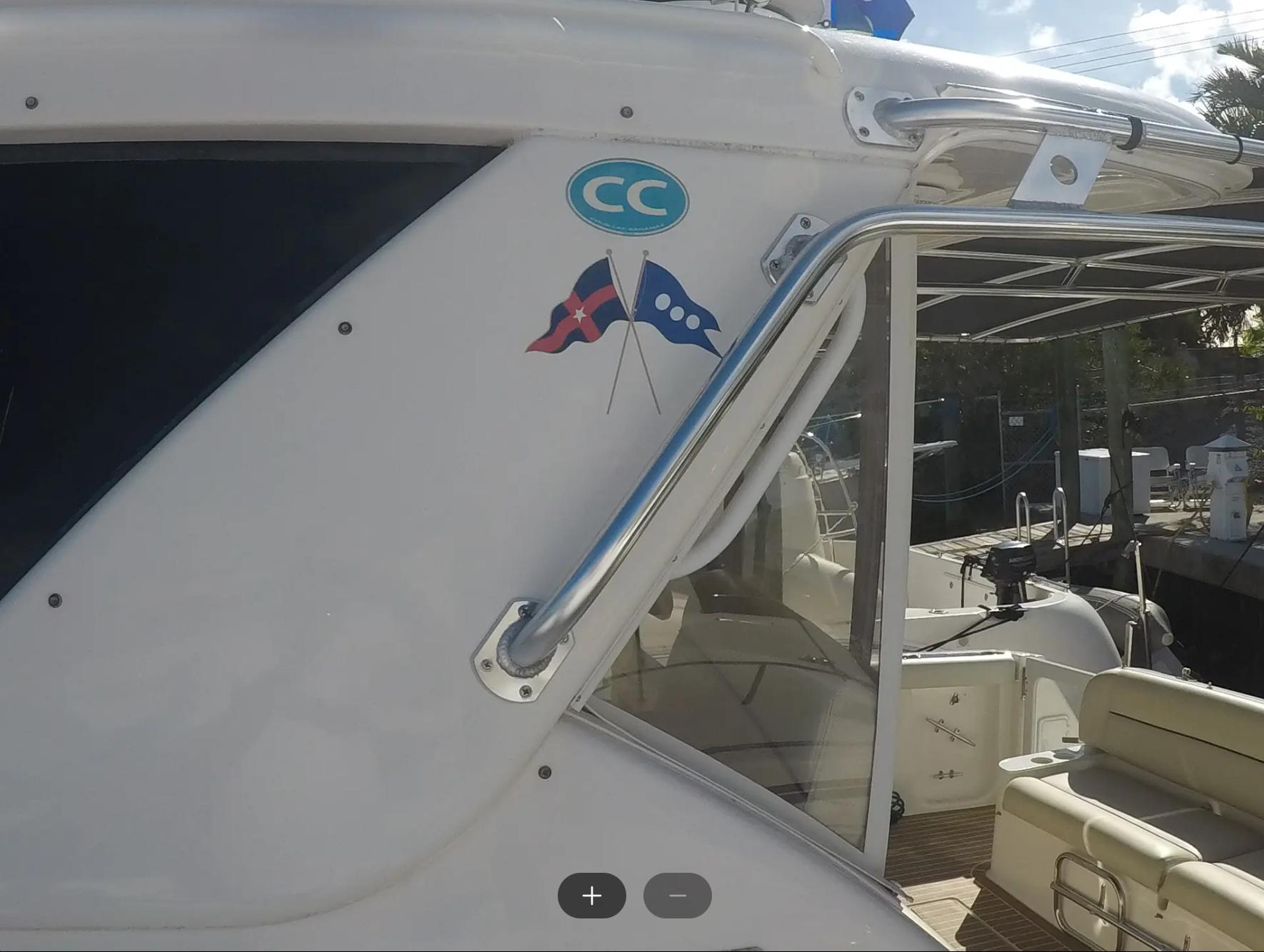 Tiara Yachts-4400 Sovran 2004-CC Rider FL-US-2004 Tiara Yachts 4400 Sovran, side view with nautical flags and seating area.-9631623 | Thumbnail