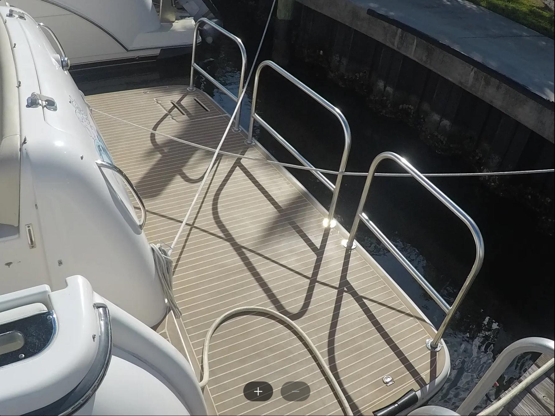 Tiara Yachts-4400 Sovran 2004-CC Rider FL-US-2004 Tiara Yachts 4400 Sovran deck with railing, docked by the water.-9631623 | Thumbnail