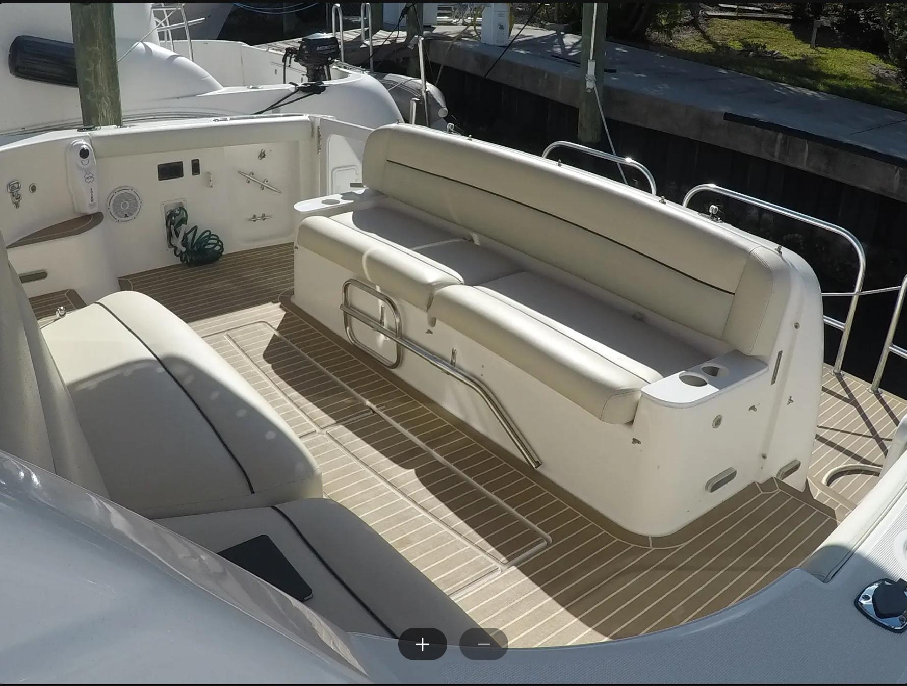 Tiara Yachts-4400 Sovran 2004-CC Rider FL-US-2004 Tiara Yachts 4400 Sovran cockpit with cushioned seating and teak flooring.-9631623 | Thumbnail