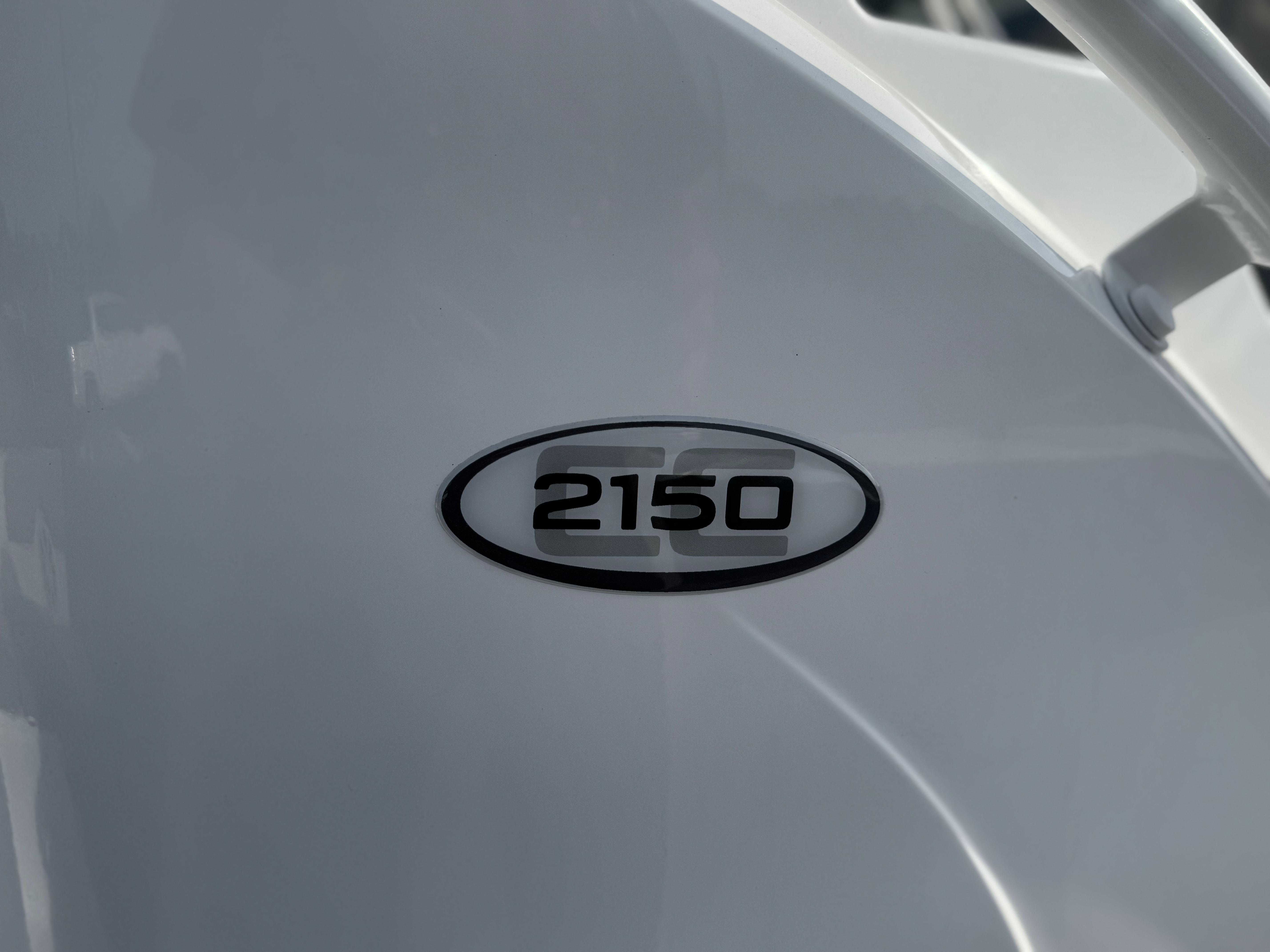 2025 Tahoe 2150 CC model emblem on a sleek white surface.