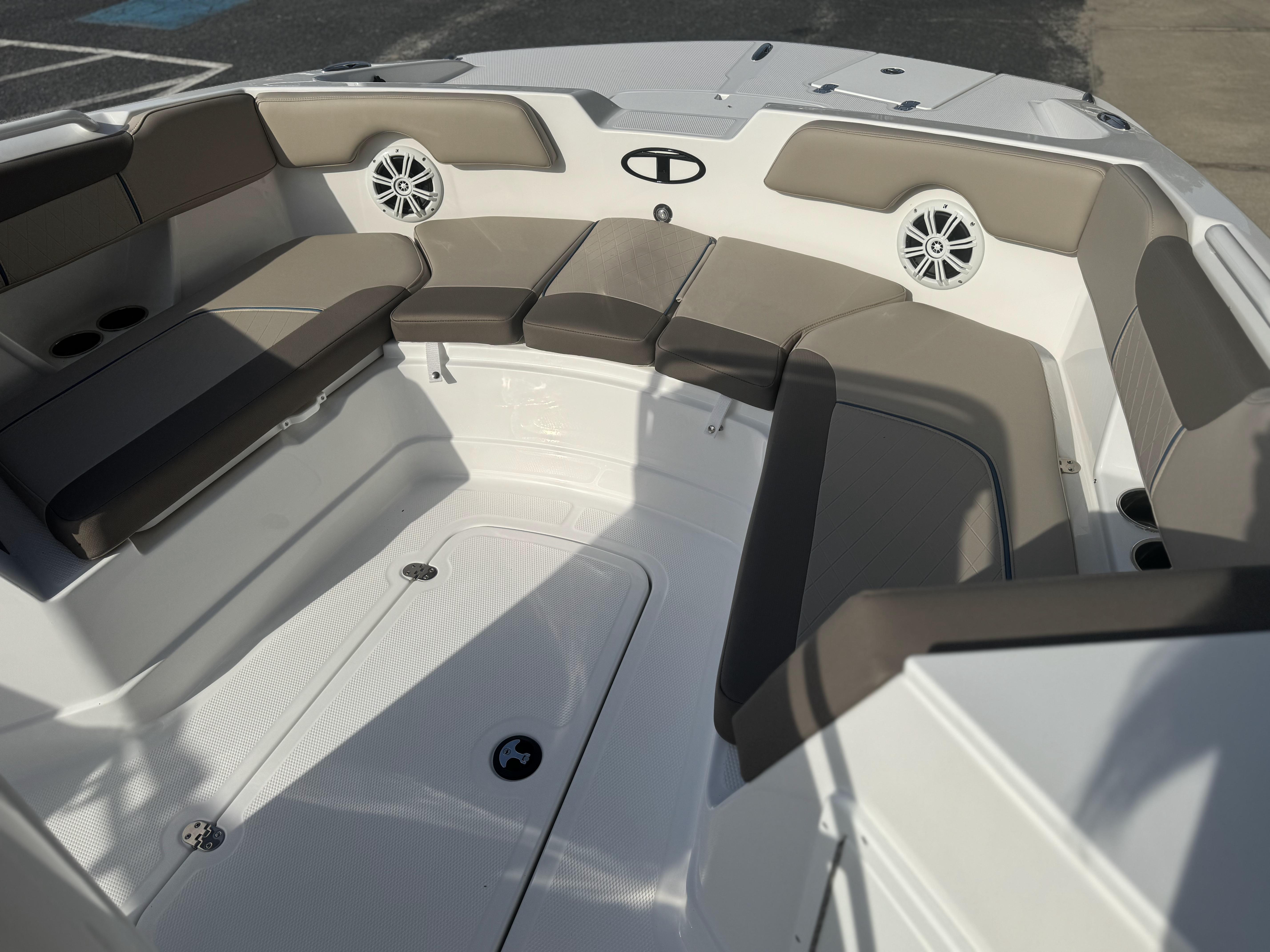 2025 Tahoe 2150 CC boat interior with cushioned seating and built-in speakers.