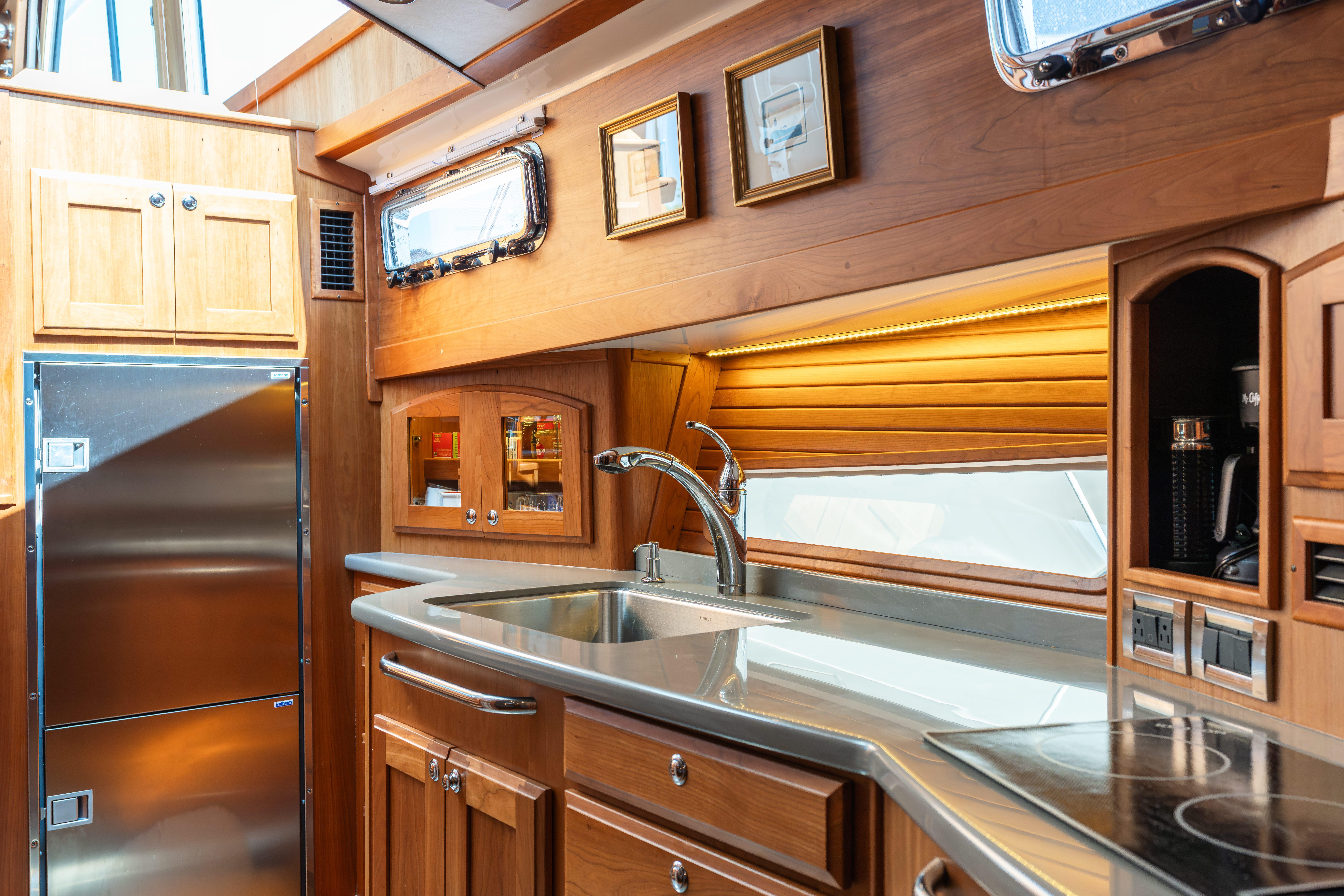 Luxurious kitchen interior of 2020 Sabre 48 Salon Express yacht with modern amenities.