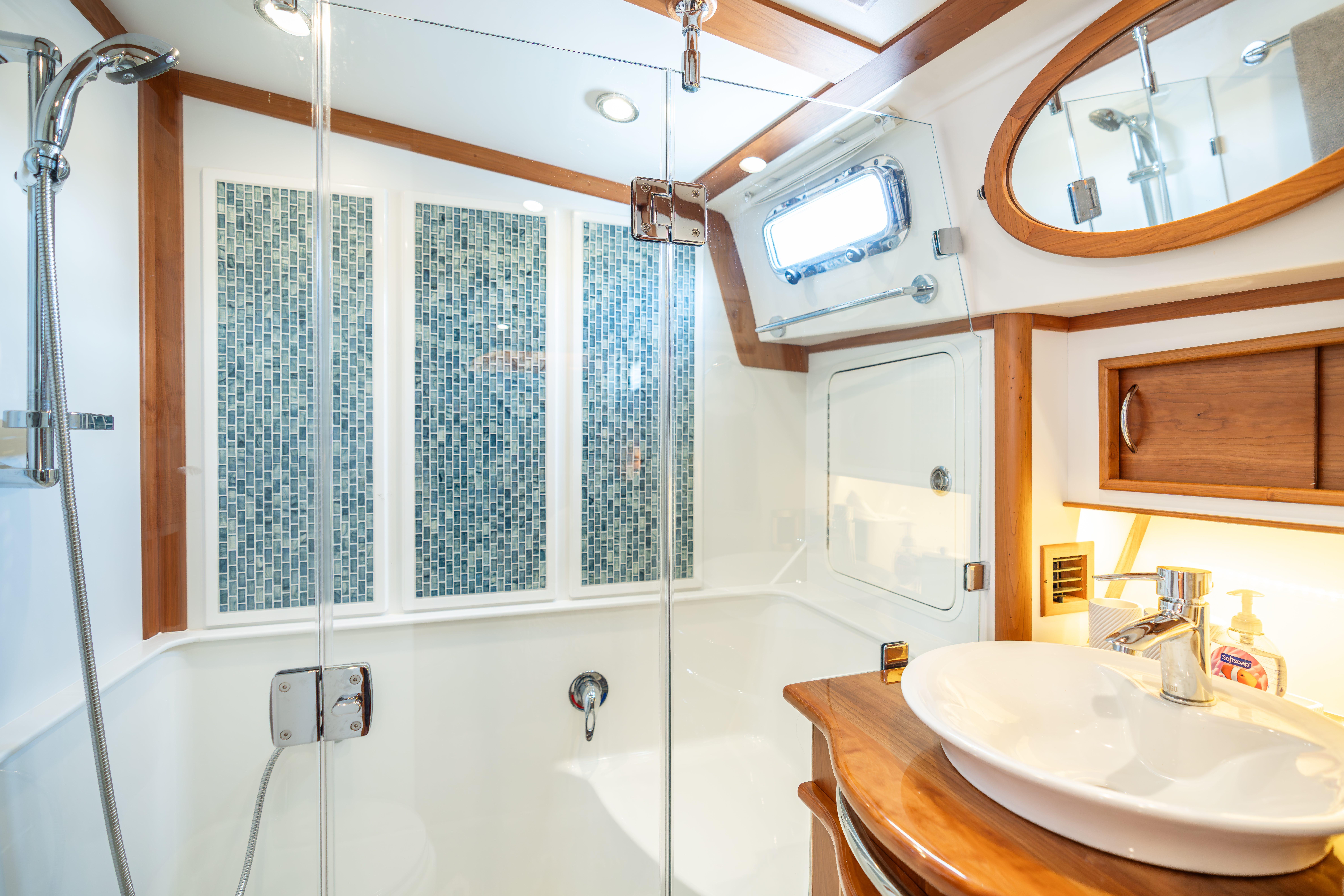 Luxurious bathroom in 2020 Sabre 48 Salon Express yacht with modern fixtures and elegant design.
