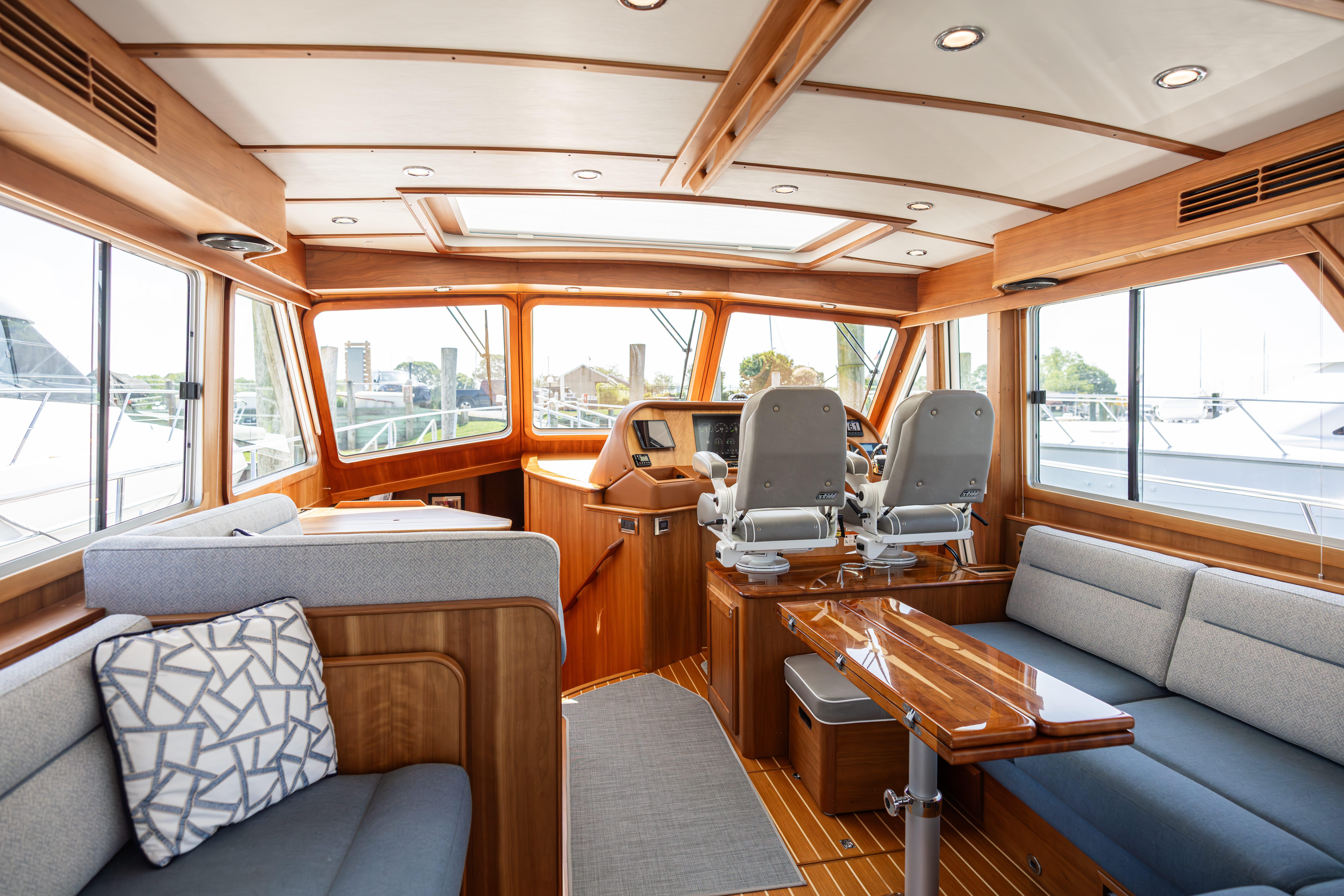 Interior of 2020 Sabre 48 Salon Express yacht with elegant wood finish and modern seating.