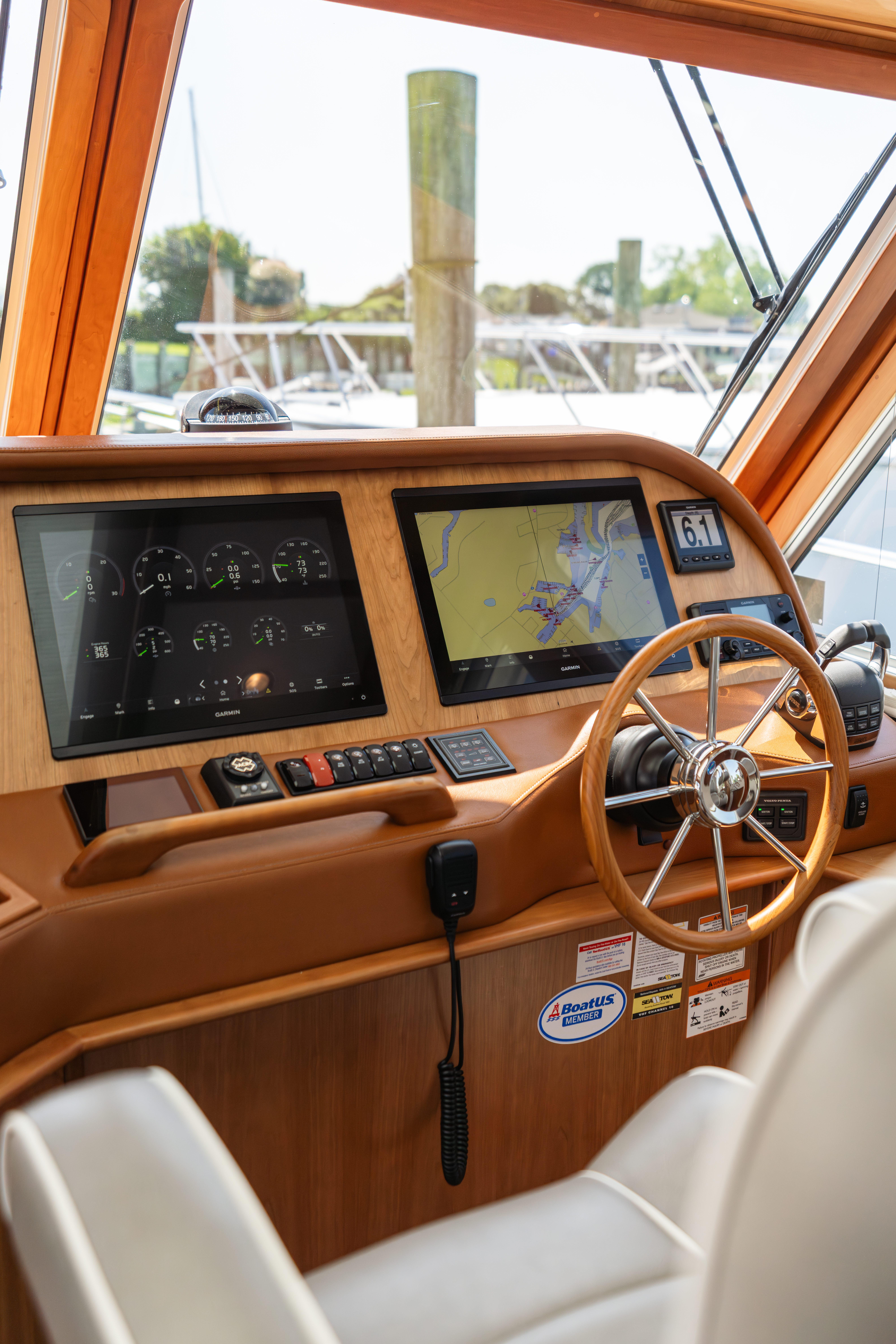 2020 Sabre 48 Salon Express helm with navigation screens and steering wheel.