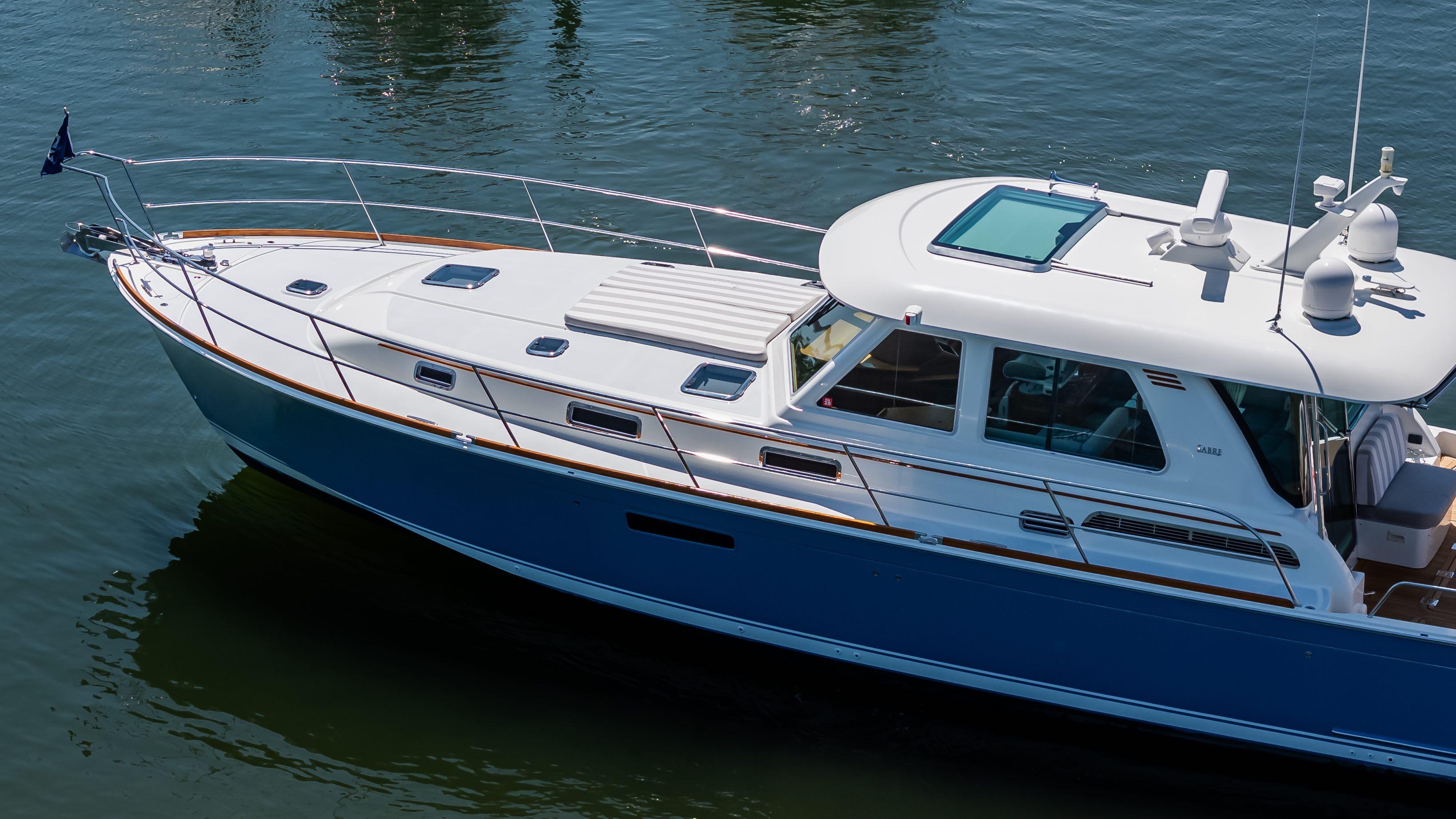 2020 Sabre 48 Salon Express yacht on calm water, showcasing sleek design and luxury features.
