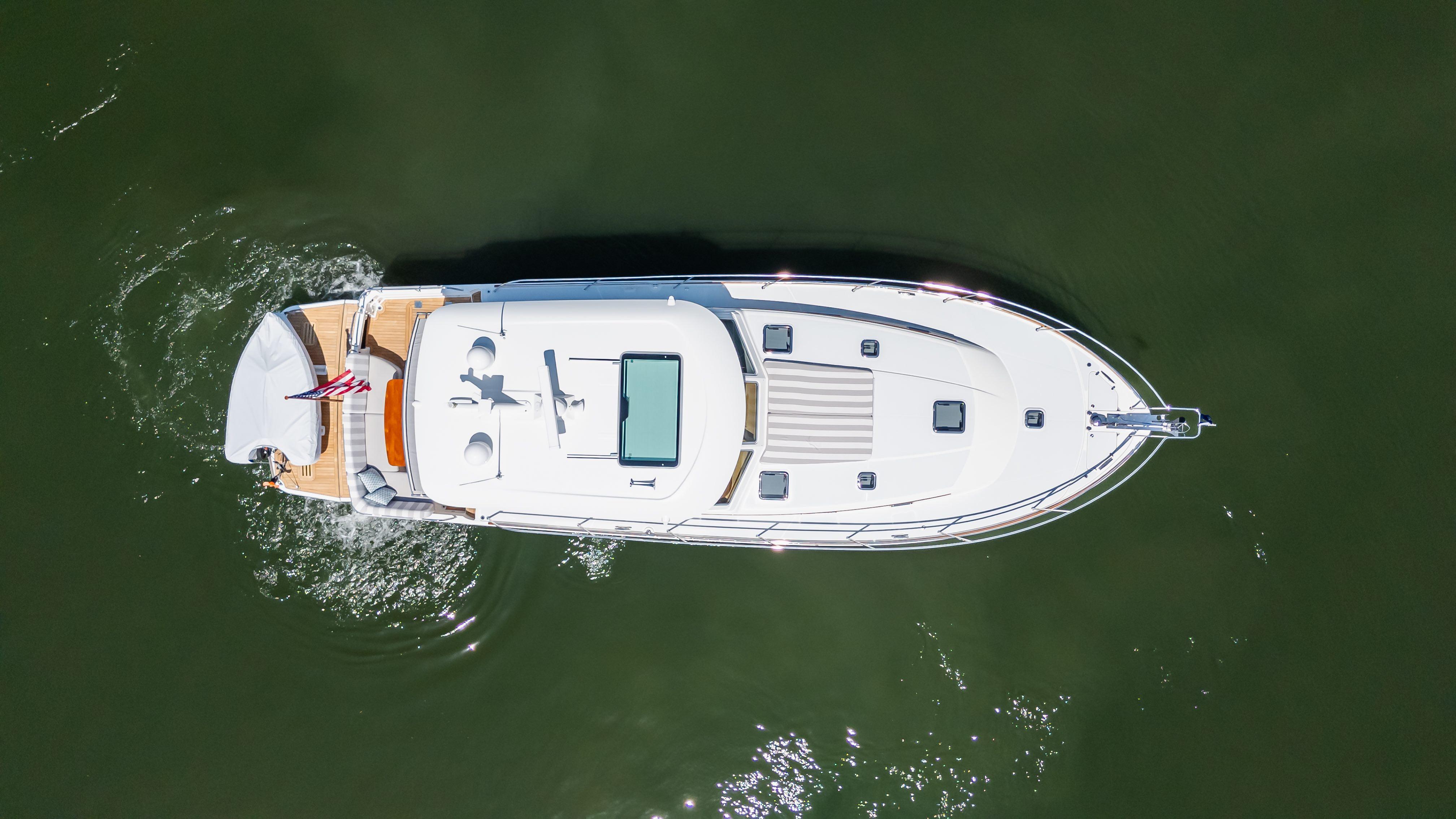 Aerial view of 2020 Sabre 48 Salon Express yacht cruising on water.
