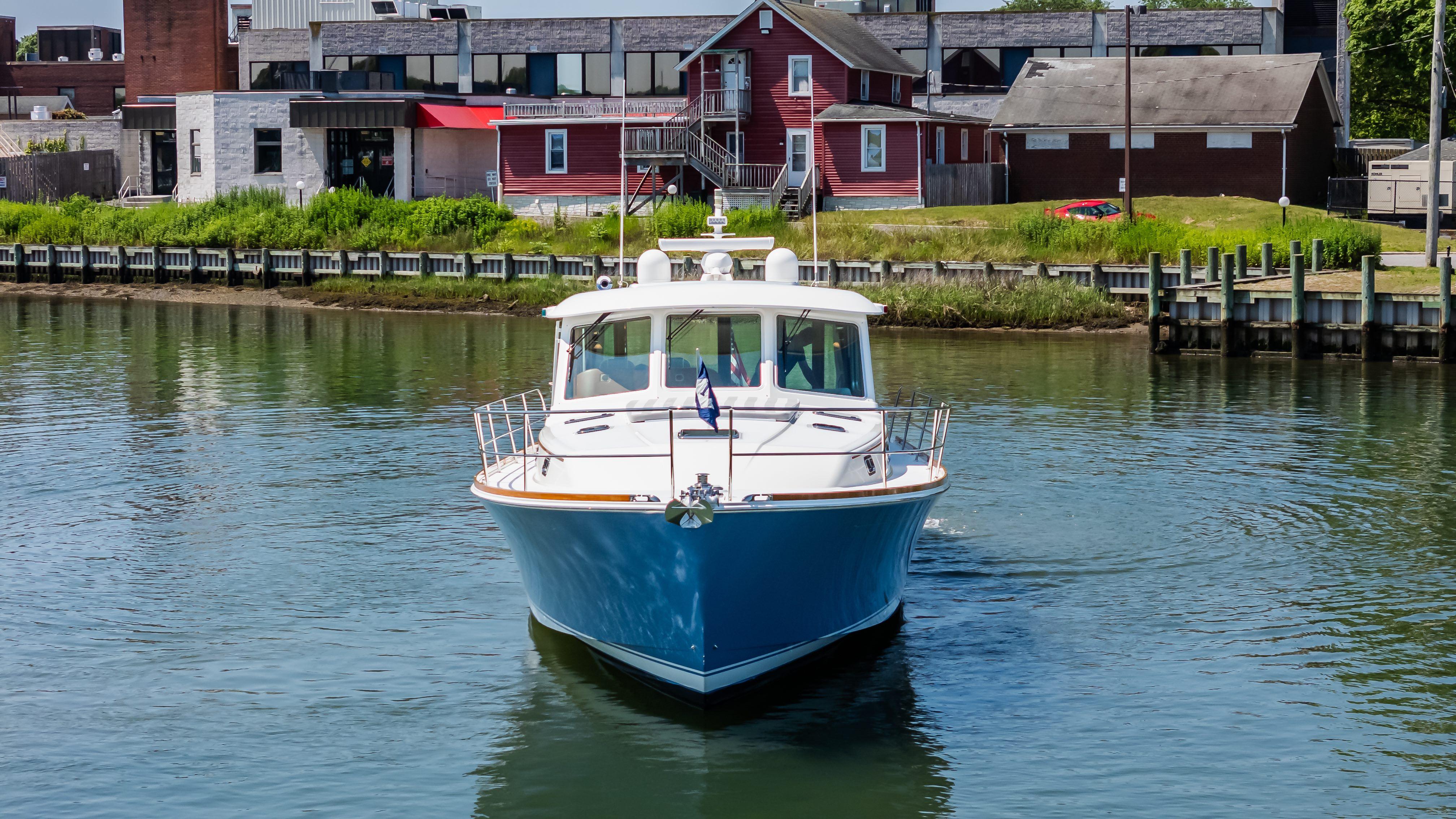 2020 Sabre 48 Salon Express yacht cruising in a calm harbor.