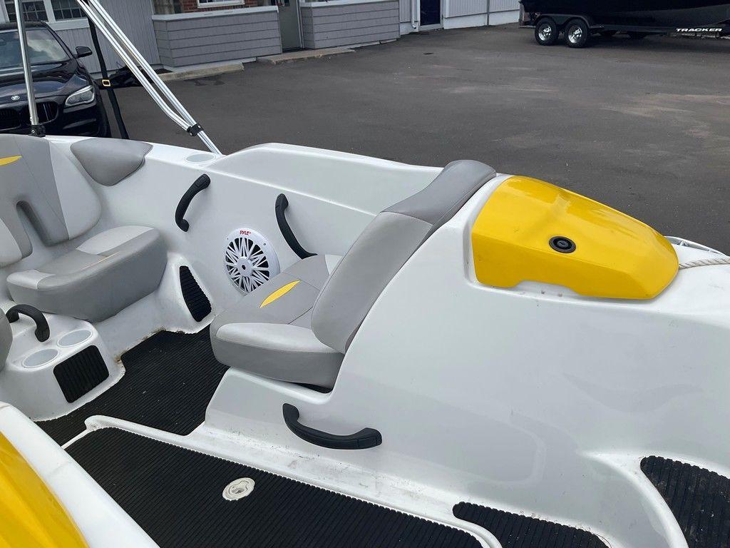 2009 Sea-Doo 150 Speedster 255 interior with gray seats and yellow accents.
