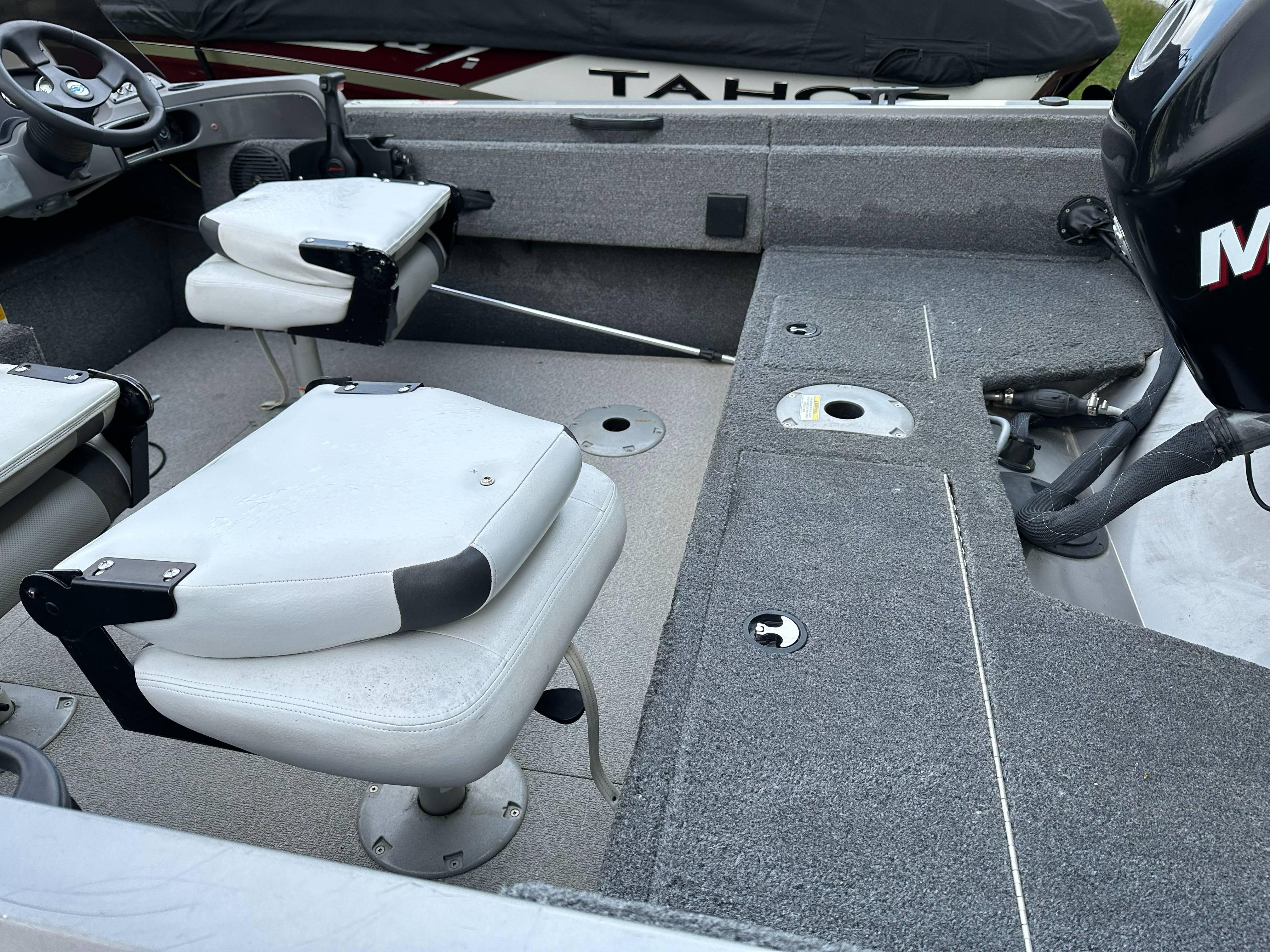 2013 Crestliner Fish Hawk 1650 SC interior with seating and motor, showcasing fishing setup.