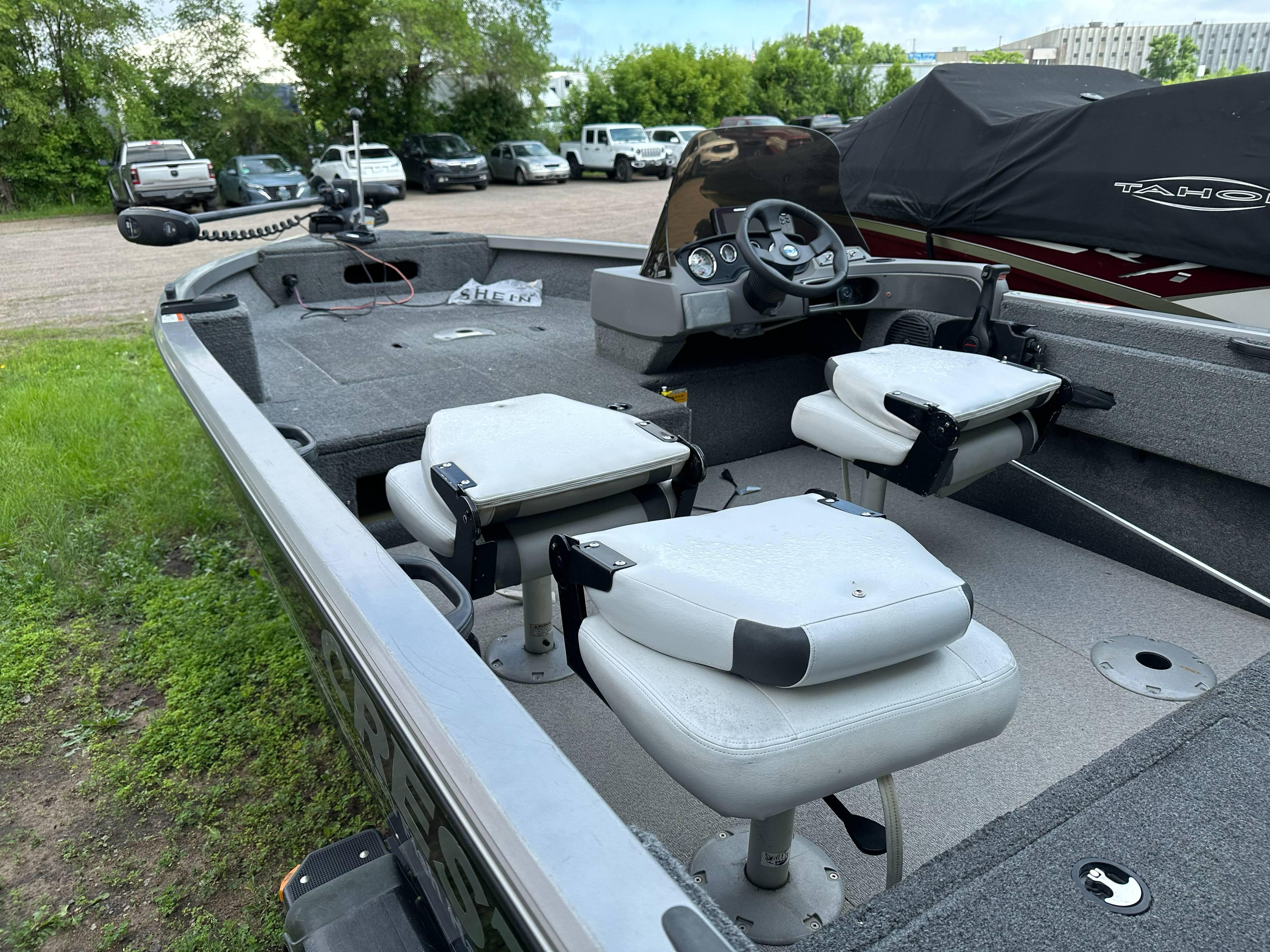 2013 Crestliner Fish Hawk 1650 SC boat interior with seating and steering console.