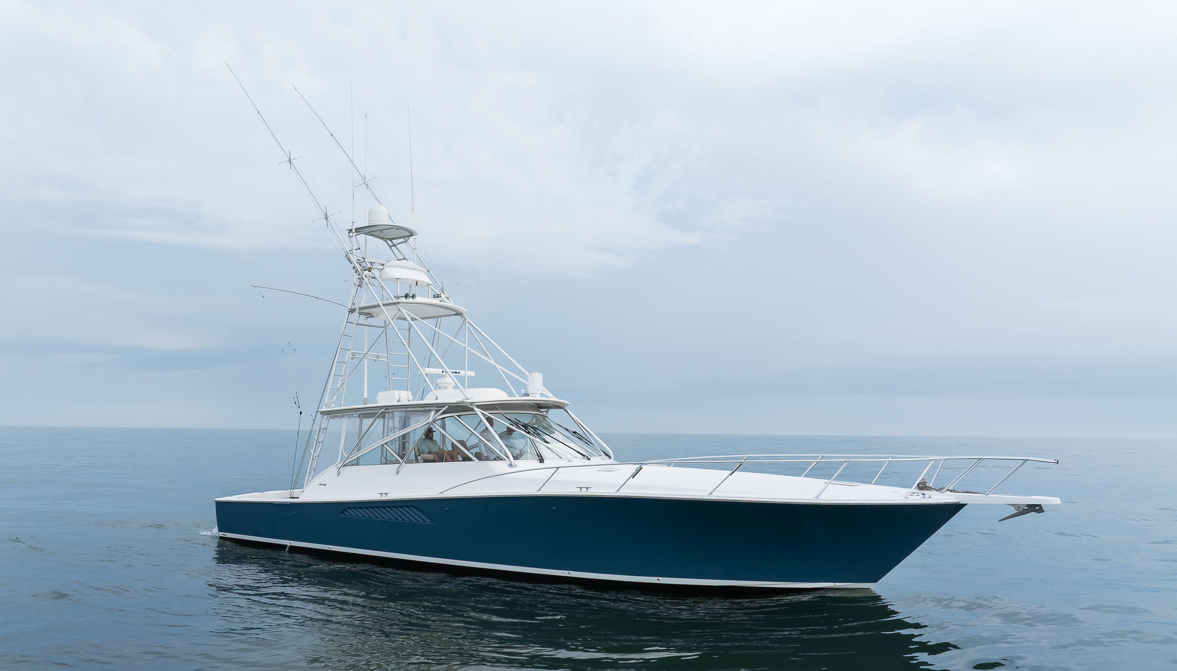 Picture of Expresso Viking 52 ft' Express 2007 Viking Express boat on calm ocean waters under cloudy sky. 