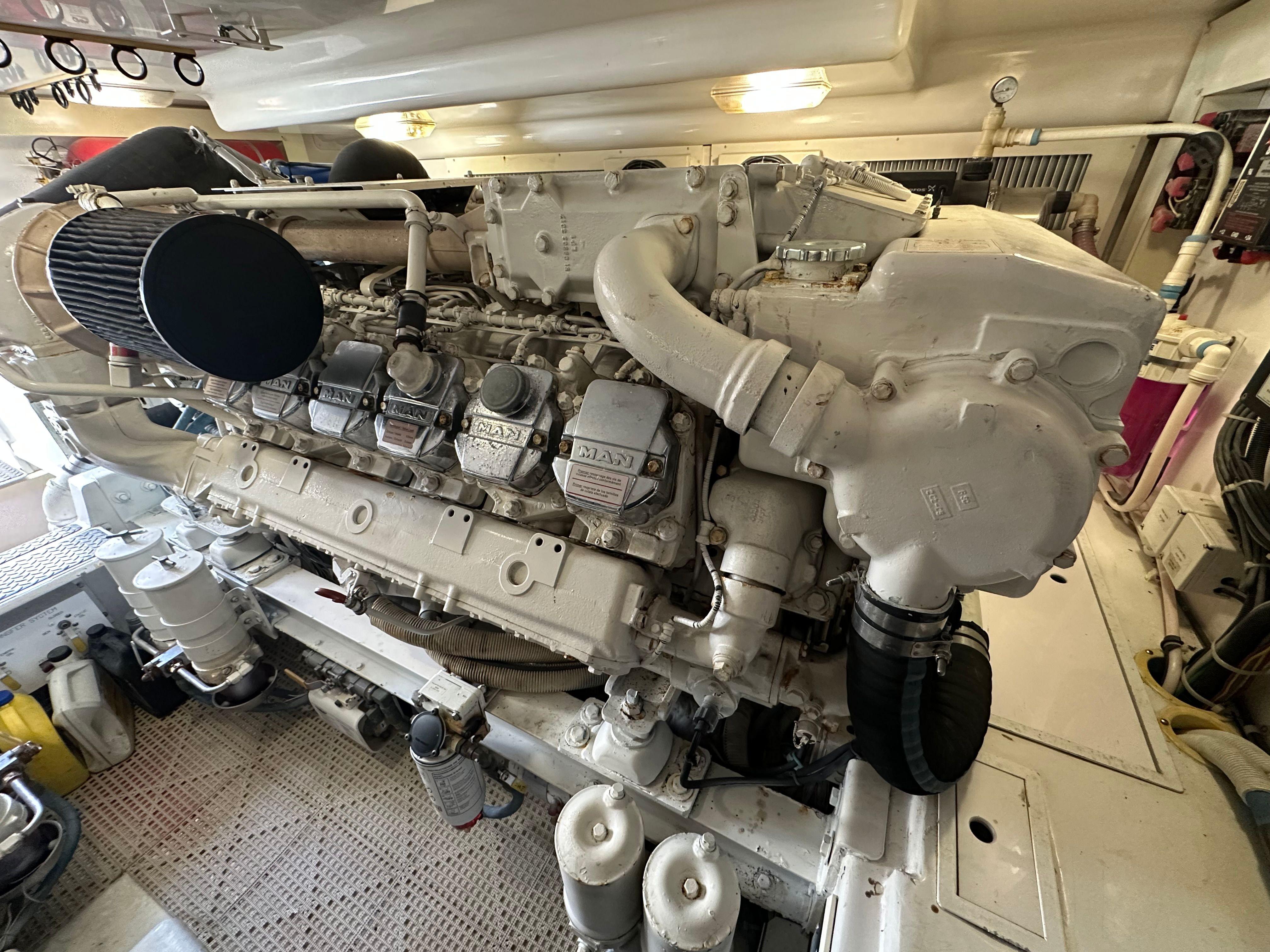 Picture of Expresso Viking 52 ft' Express Engine room of a 2007 Viking Express boat, showcasing a powerful marine engine. 