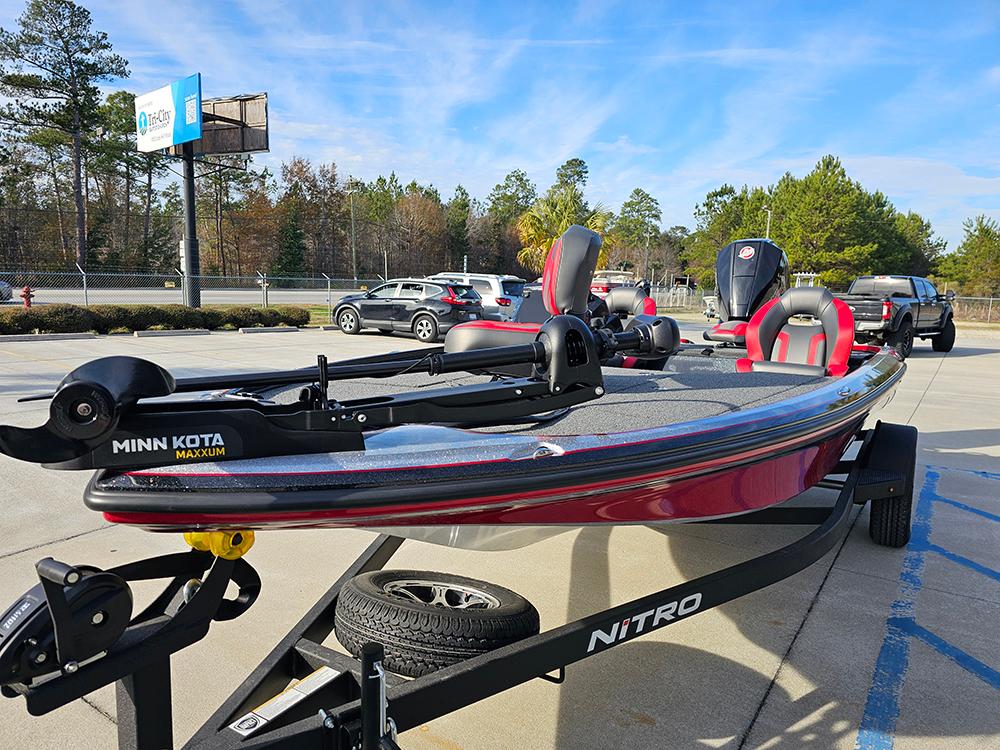 2025 Nitro Z18 boat with Minn Kota motor on trailer, parked outdoors.