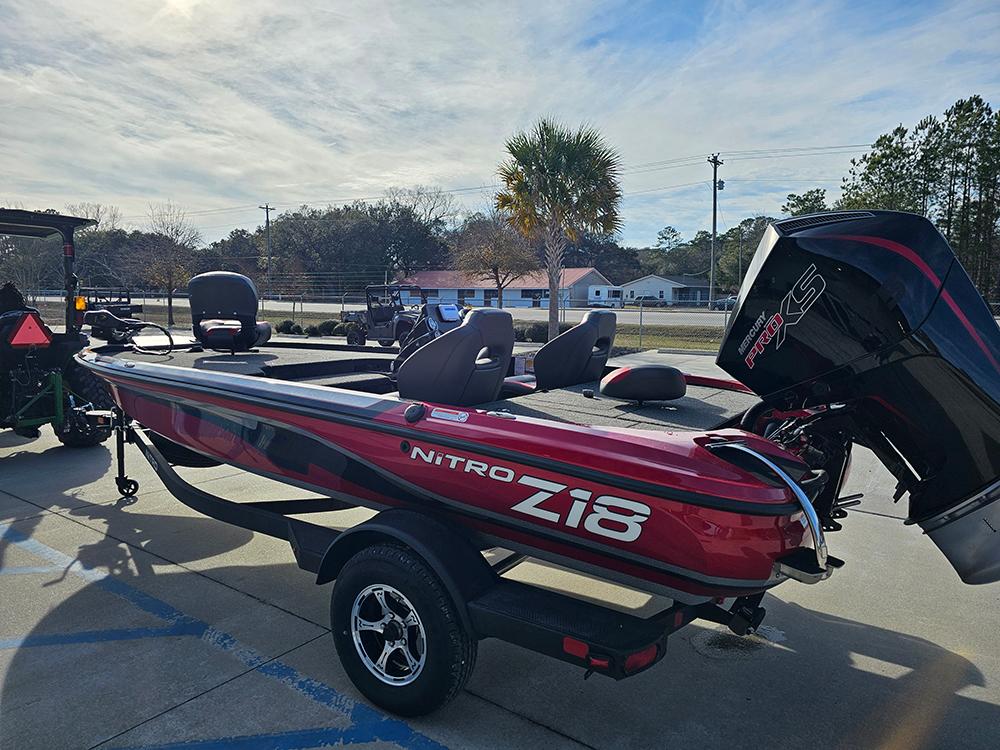 2025 Nitro Z18 boat with trailer, parked outdoors on a sunny day.