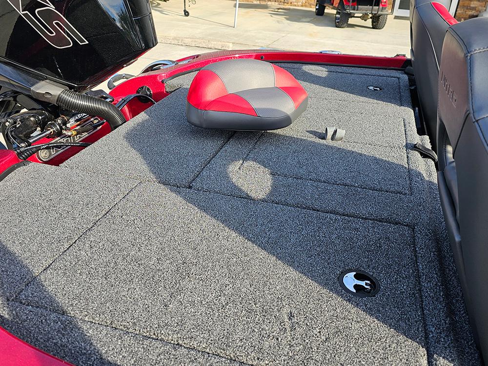 2025 Nitro Z18 boat deck with red and gray seating, featuring storage compartments.