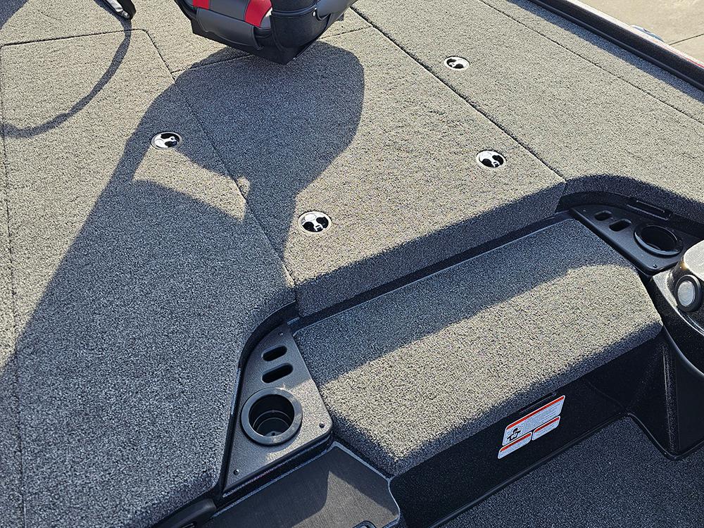 2025 Nitro Z18 boat deck with carpeted surface and fishing rod holders.