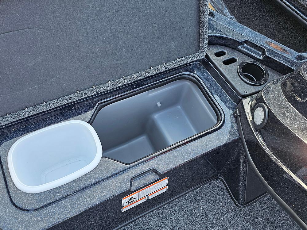 Open storage compartment in 2025 Nitro Z18 boat, featuring cup holder and organizer.