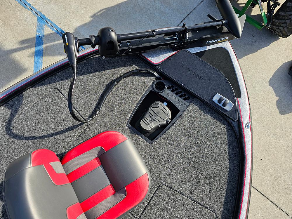 2025 Nitro Z18 boat deck with red and gray seat, trolling motor, and foot pedal.