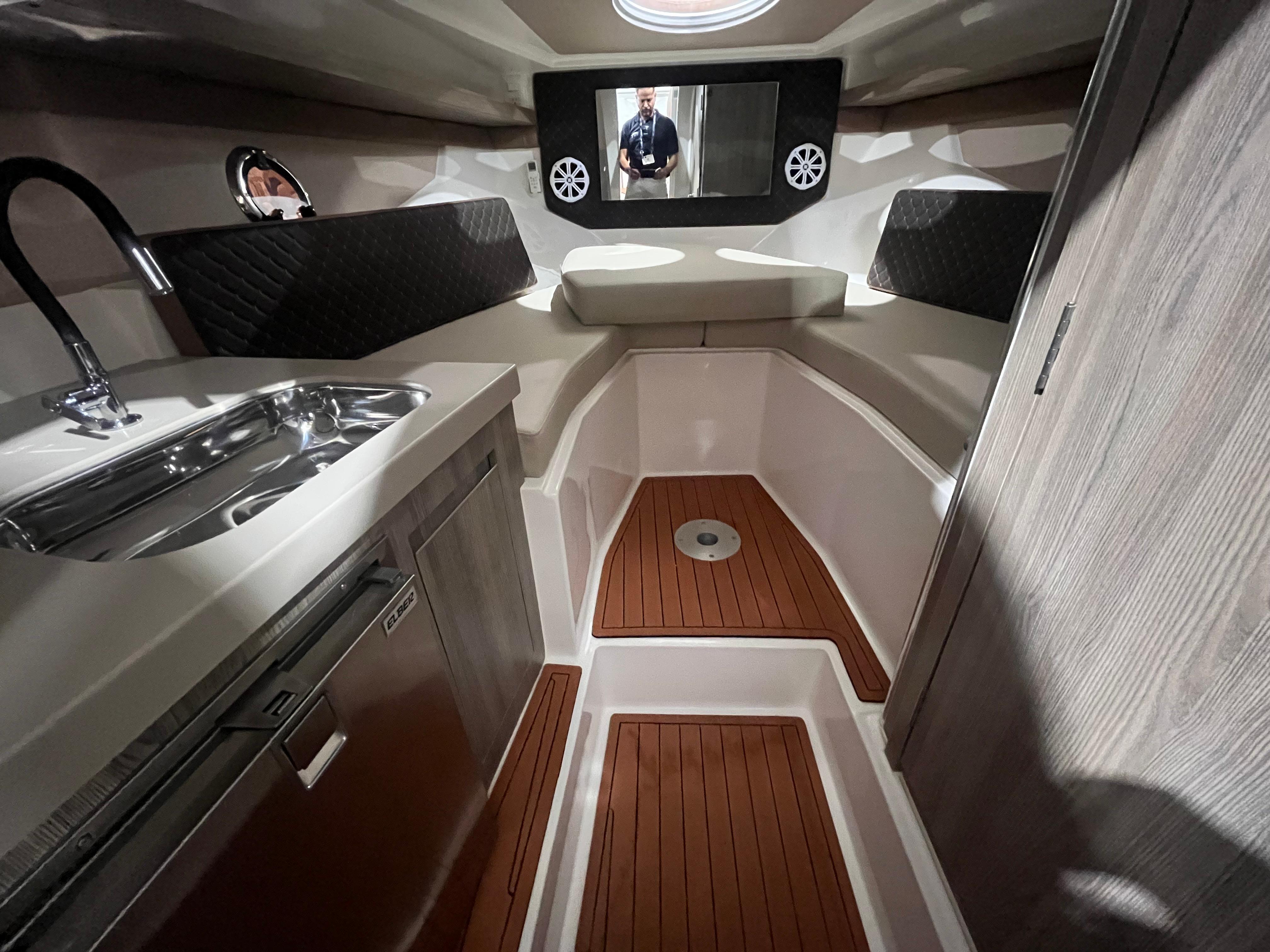Ventura-DayCruiser 2025 -FL-US-2025 Ventura DayCruiser interior with kitchenette, wood flooring, and modern design.-9681900 | Thumbnail