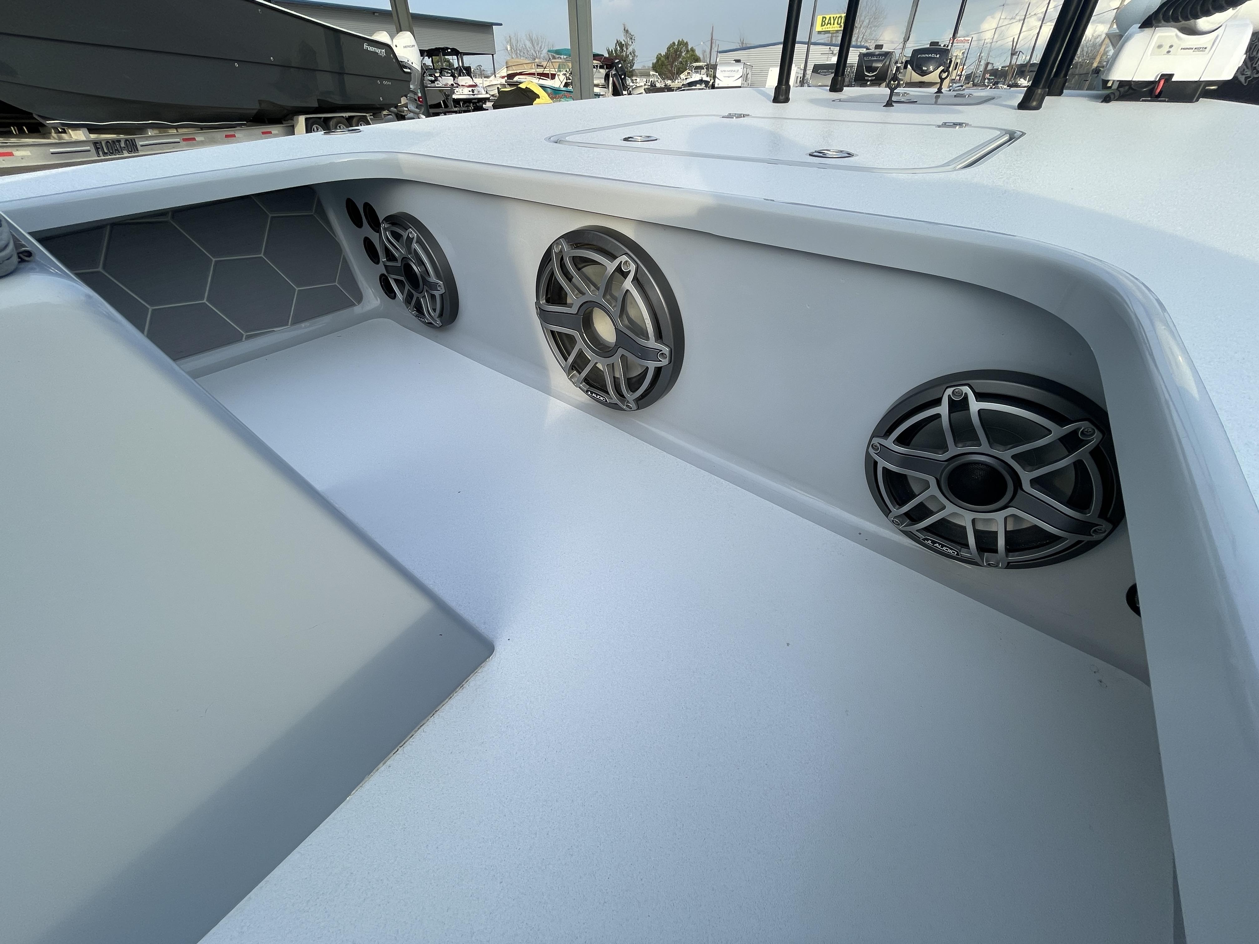Interior of 2023 ZCB 18 Curlew boat with built-in speakers and modern design.