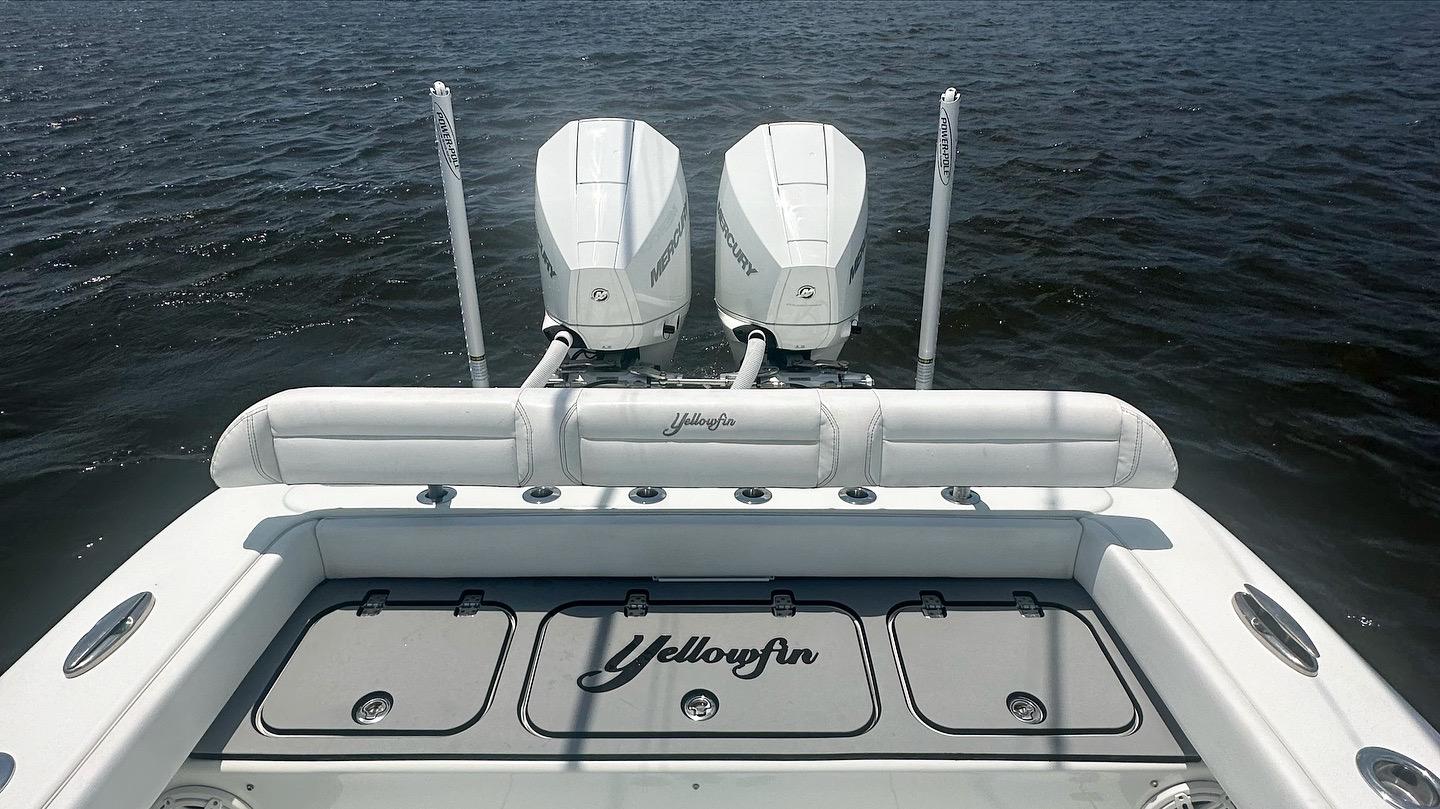 2020 Yellowfin 26 Hybrid boat with dual Mercury engines on open water.