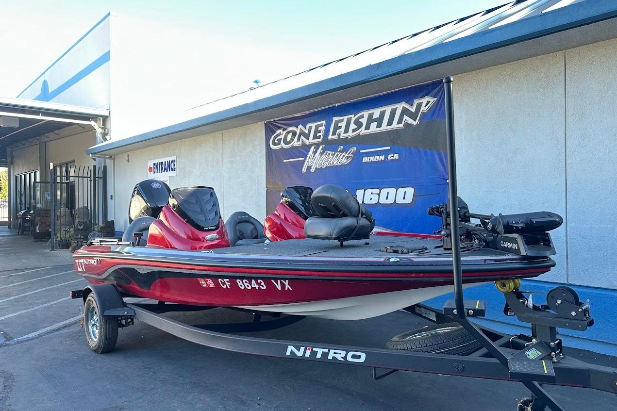2024 Nitro Z17 boat on trailer outside a marine store.