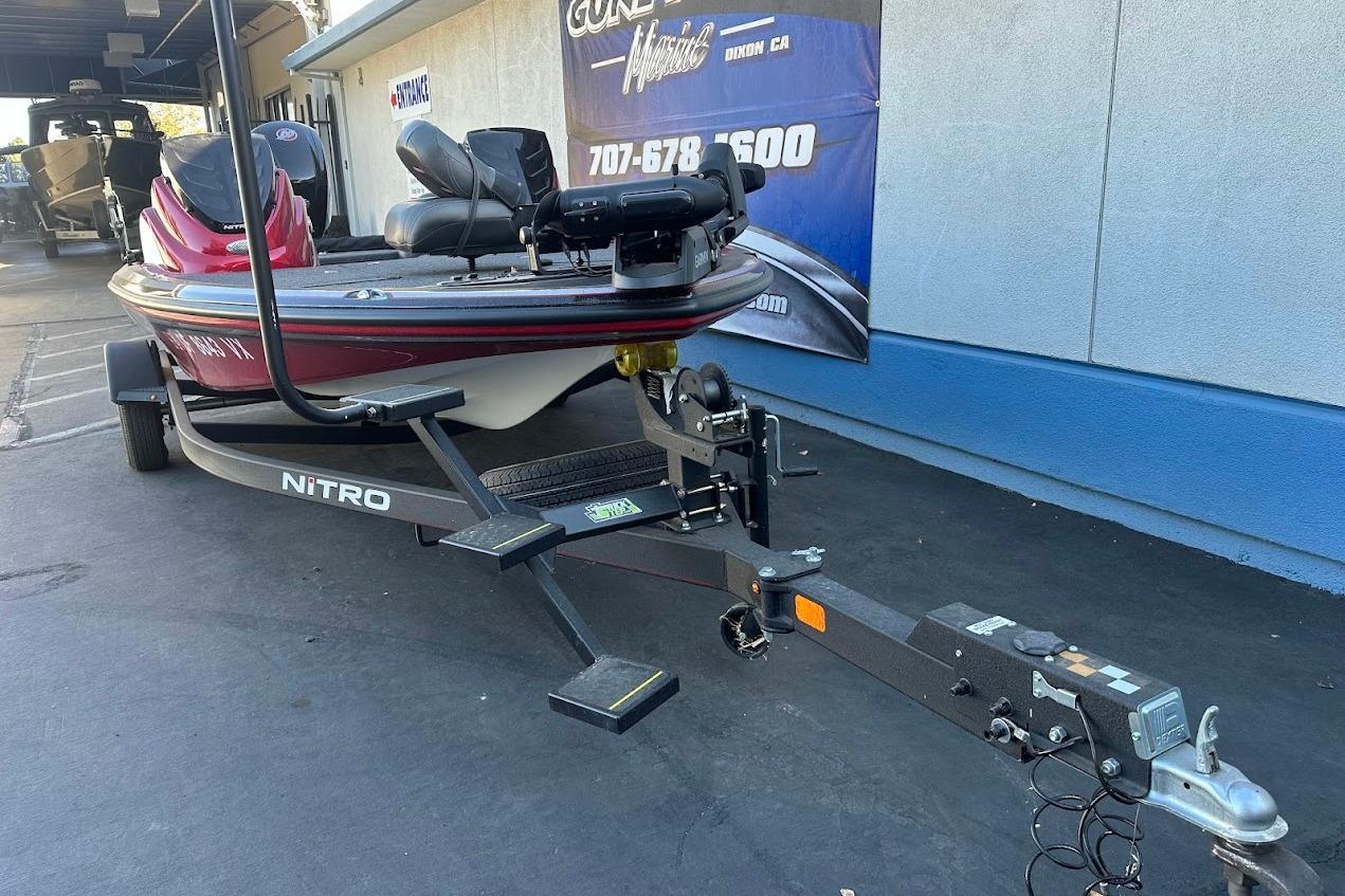 2024 Nitro Z17 boat on trailer, parked outside dealership.