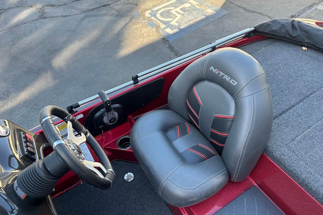 2024 Nitro Z17 boat interior with steering wheel and branded seat.