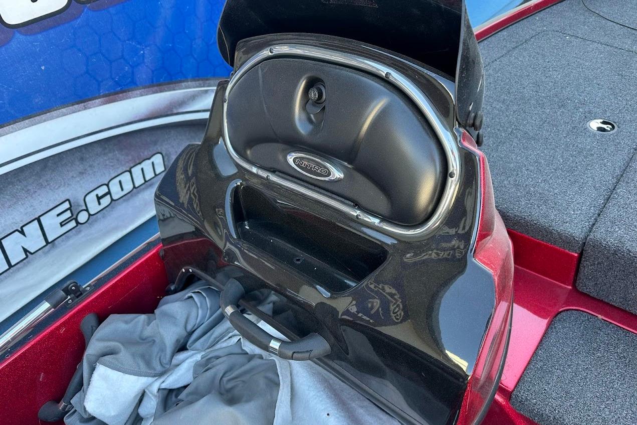 2024 Nitro Z17 boat storage compartment with open lid, showcasing interior space.
