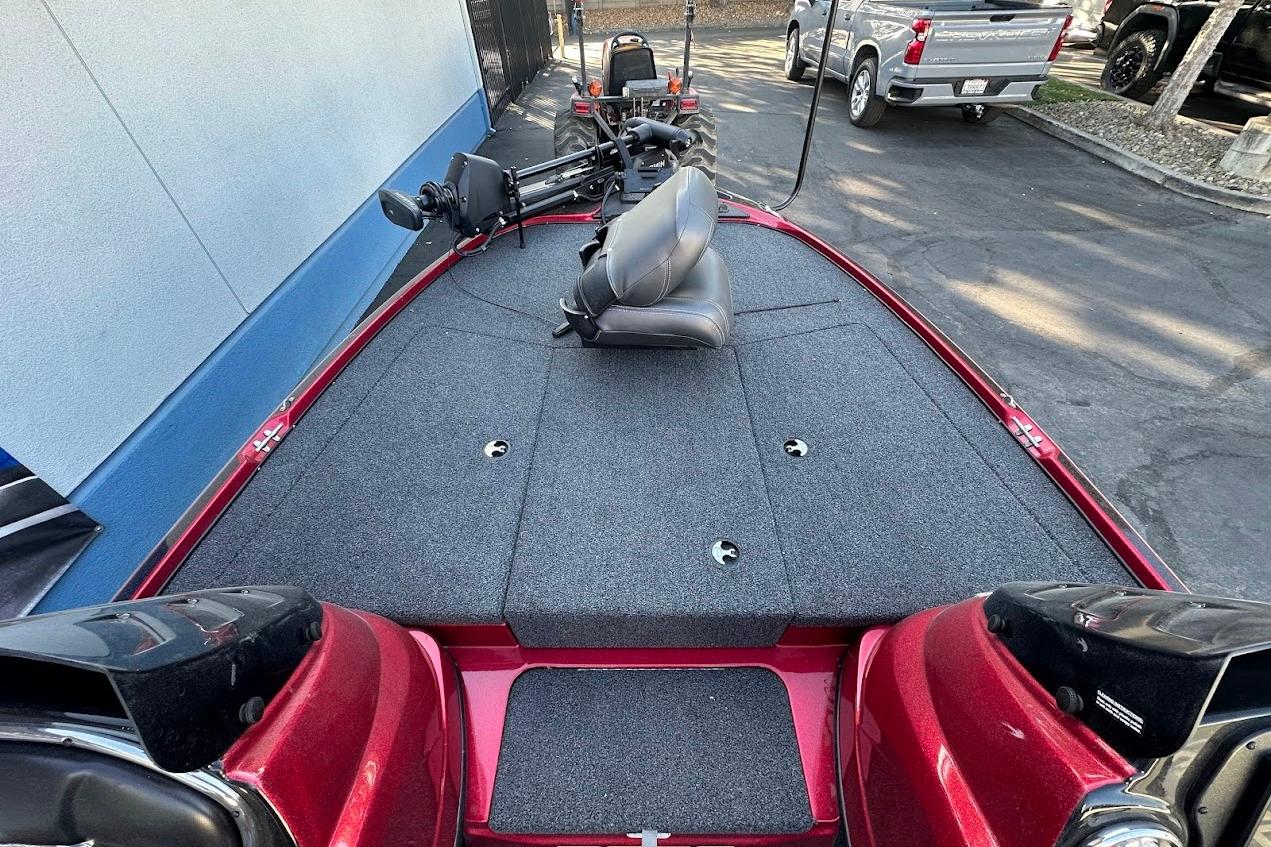 2024 Nitro Z17 boat with spacious deck and seating, parked outdoors.