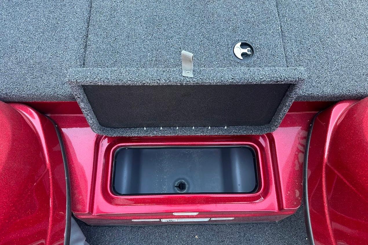 2024 Nitro Z17 boat storage compartment with open lid, featuring red and gray design.