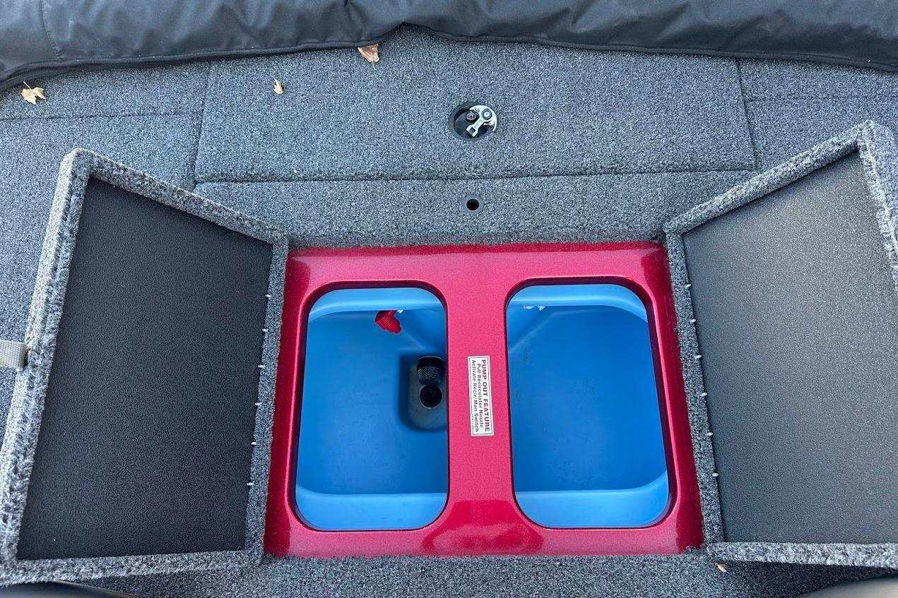 2024 Nitro Z17 boat storage compartment with open lids, featuring a blue interior.