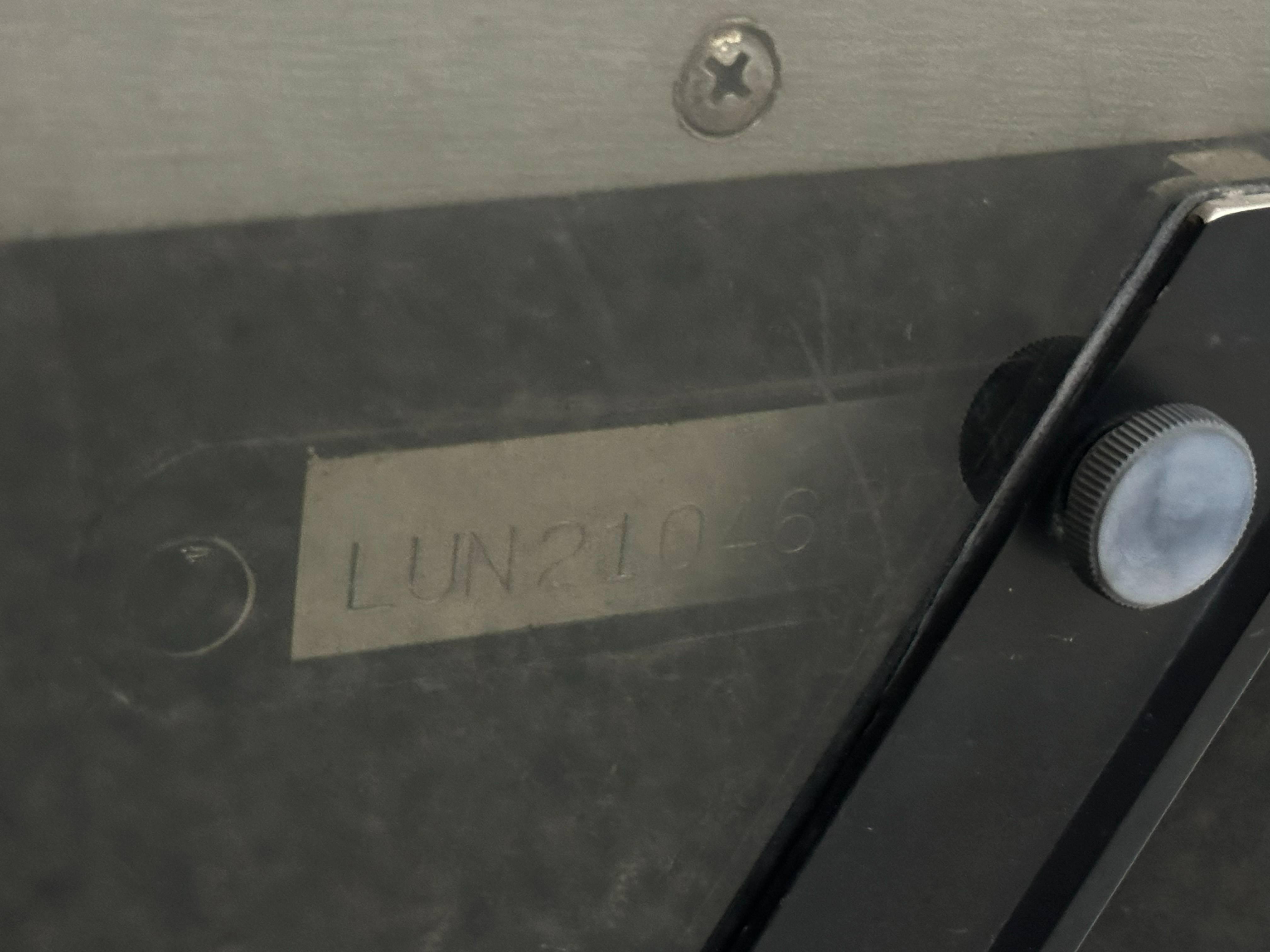 Close-up of a 1995 Lund 1650 DLX boat serial number plate.