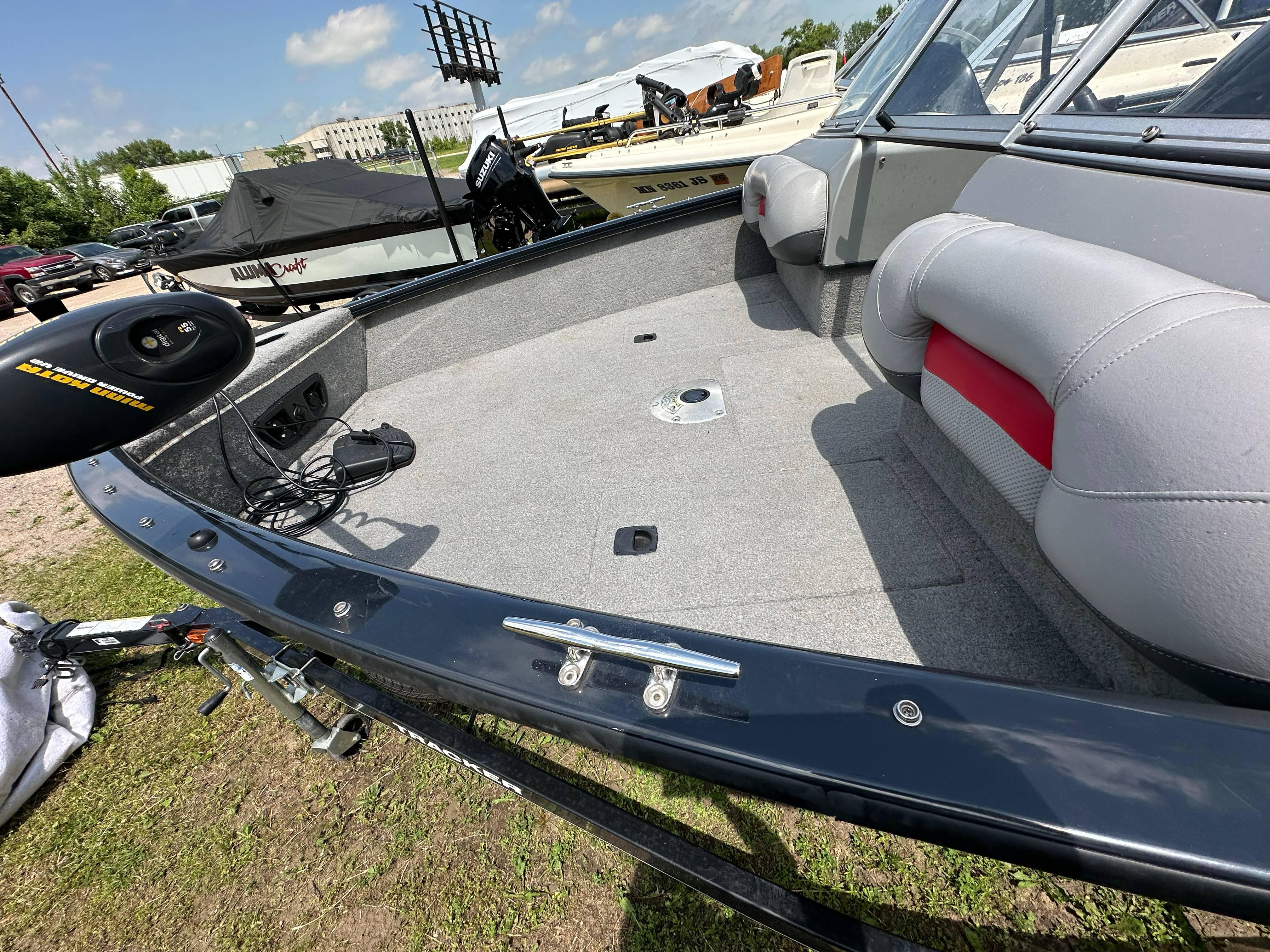 2013 Tracker Pro Guide V-175 WT boat interior with gray seating and carpeted deck.