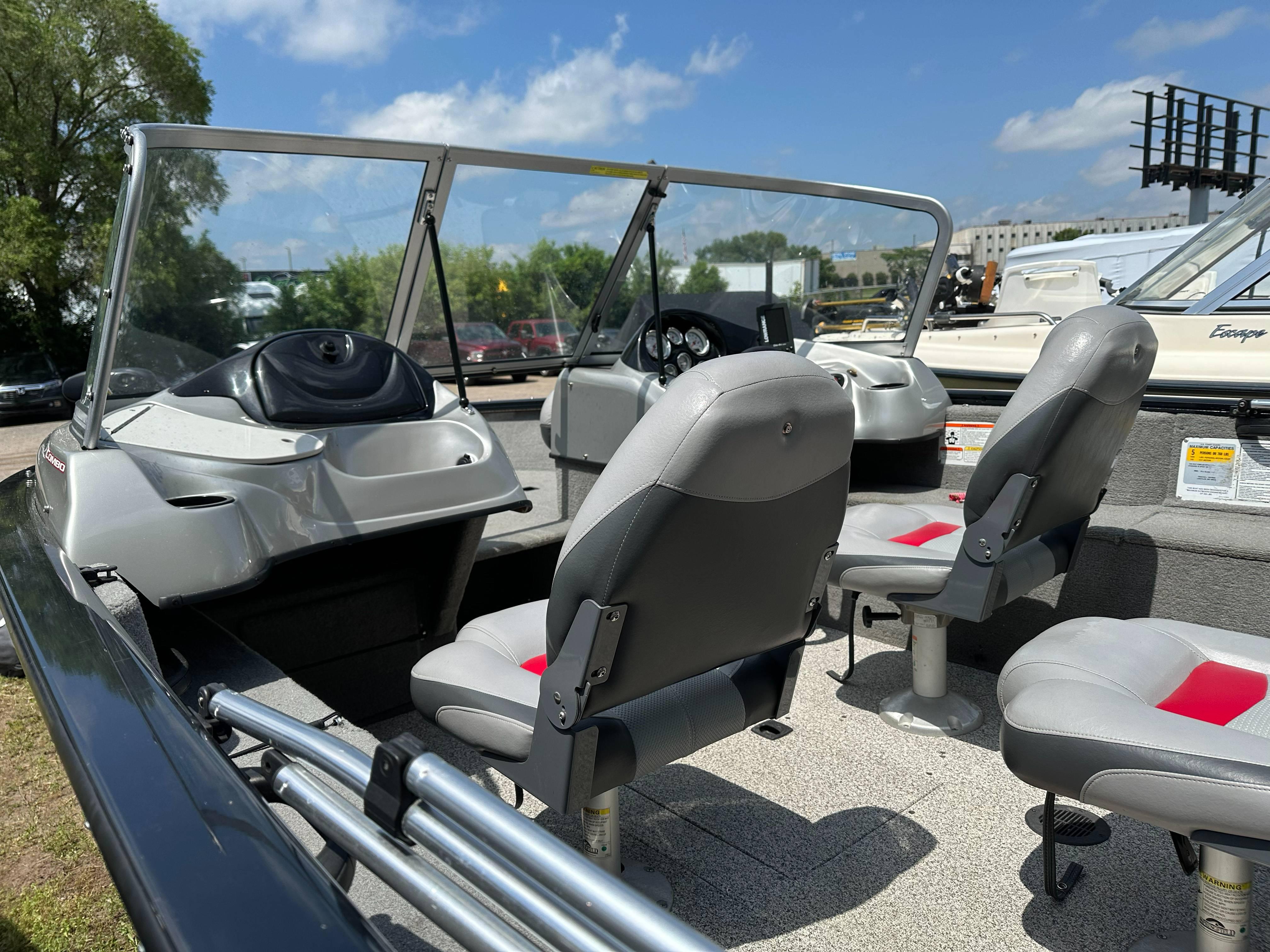 2013 Tracker Pro Guide V-175 WT boat interior with seating and steering console.